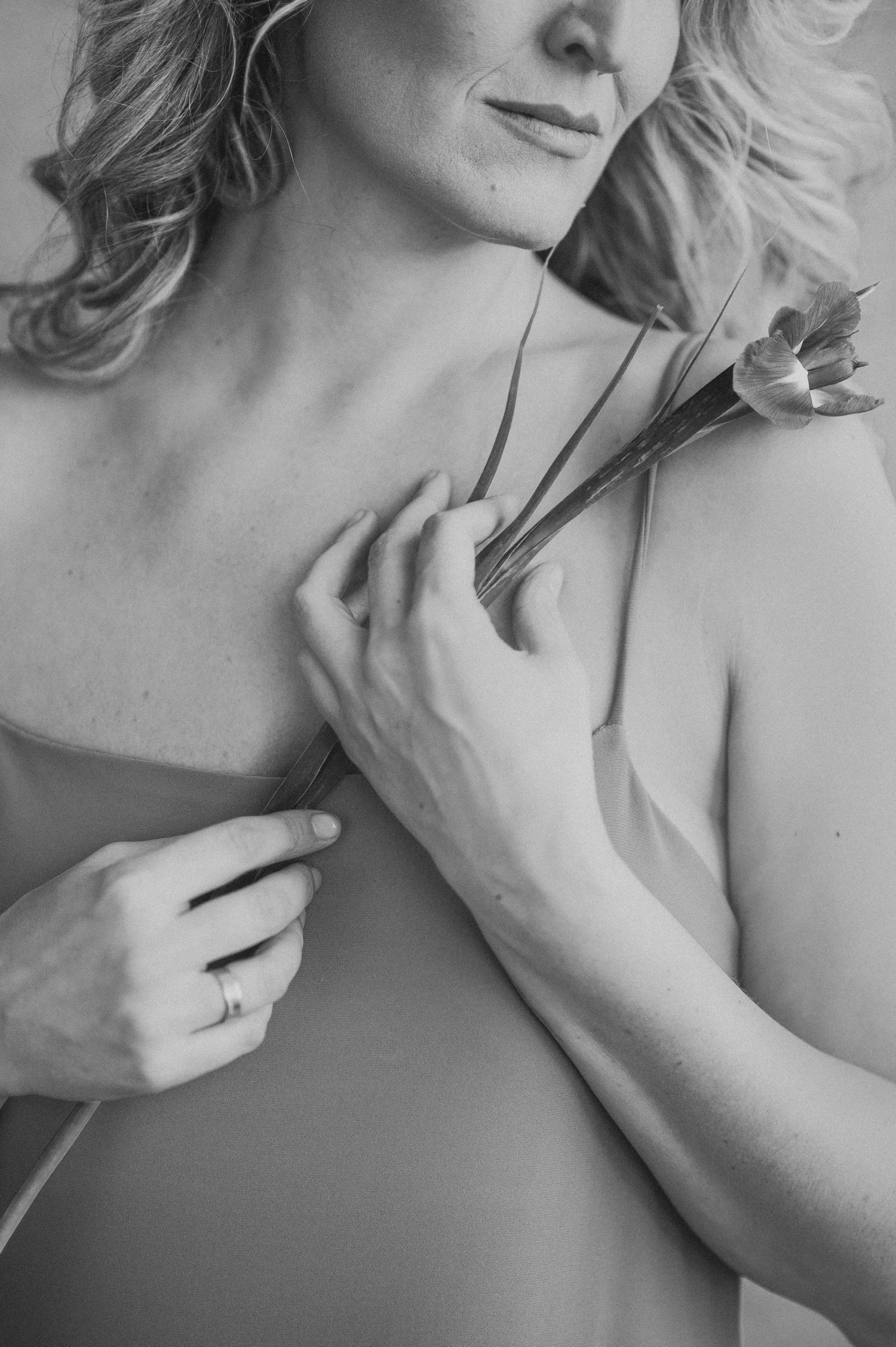 Intimate black and white boudoir photography series with soft lighting and gentle poses.