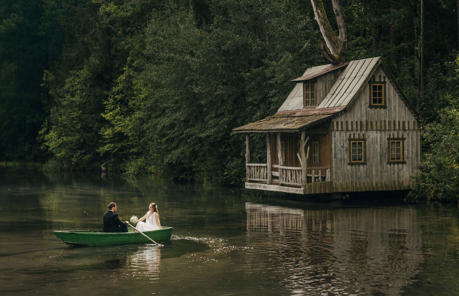 A series of photos showing a rustic waterfront house surrounded by trees reflecting on a serene lake.