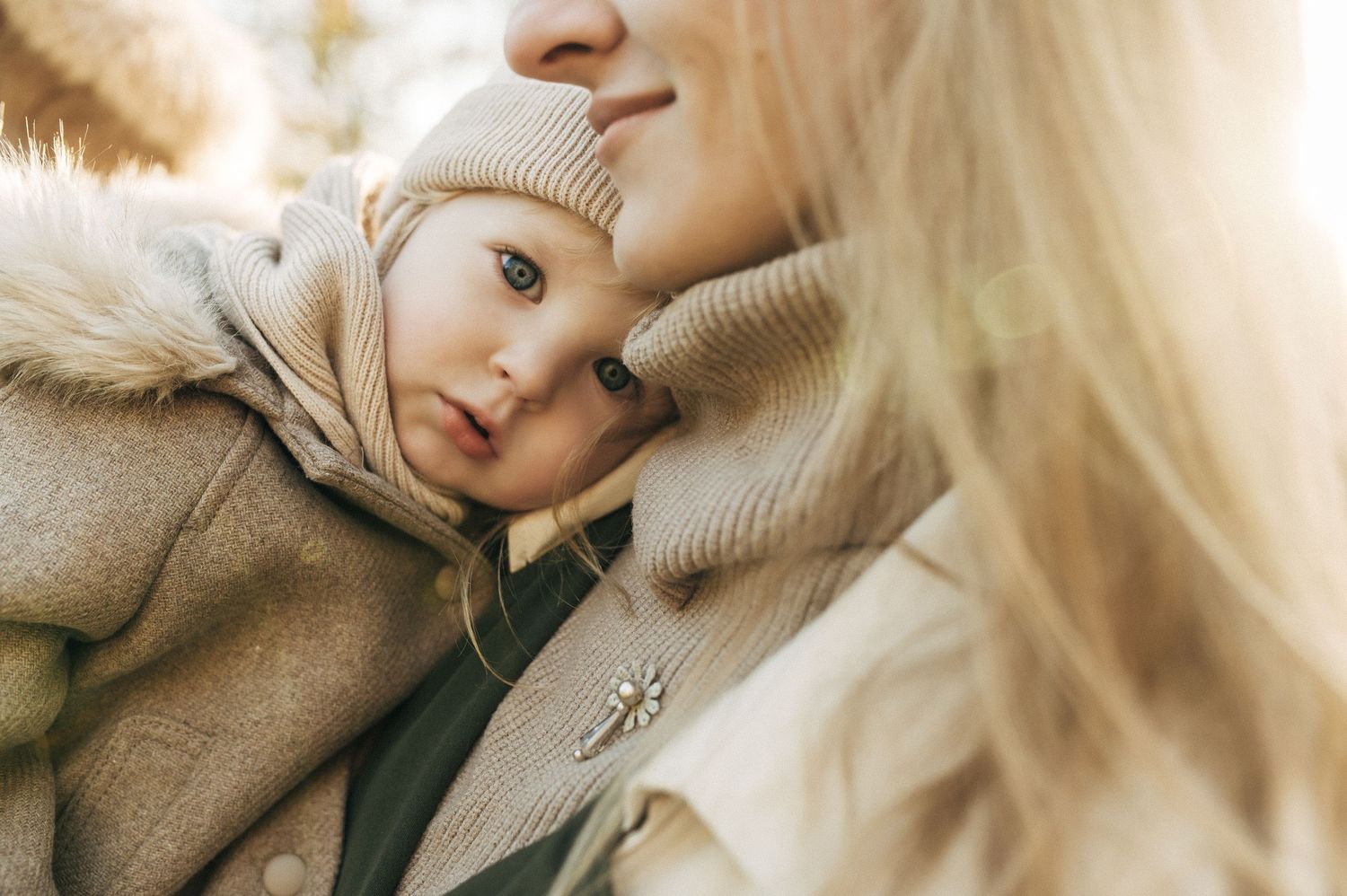 Soft beige sweater close-up portraits in natural lighting.