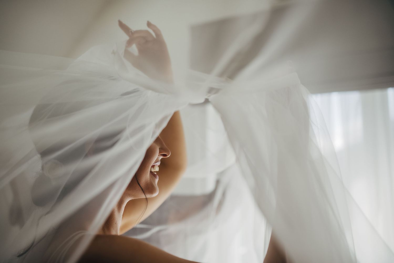 Close-up detail shots of flowing white wedding veil fabric with soft focus effects.