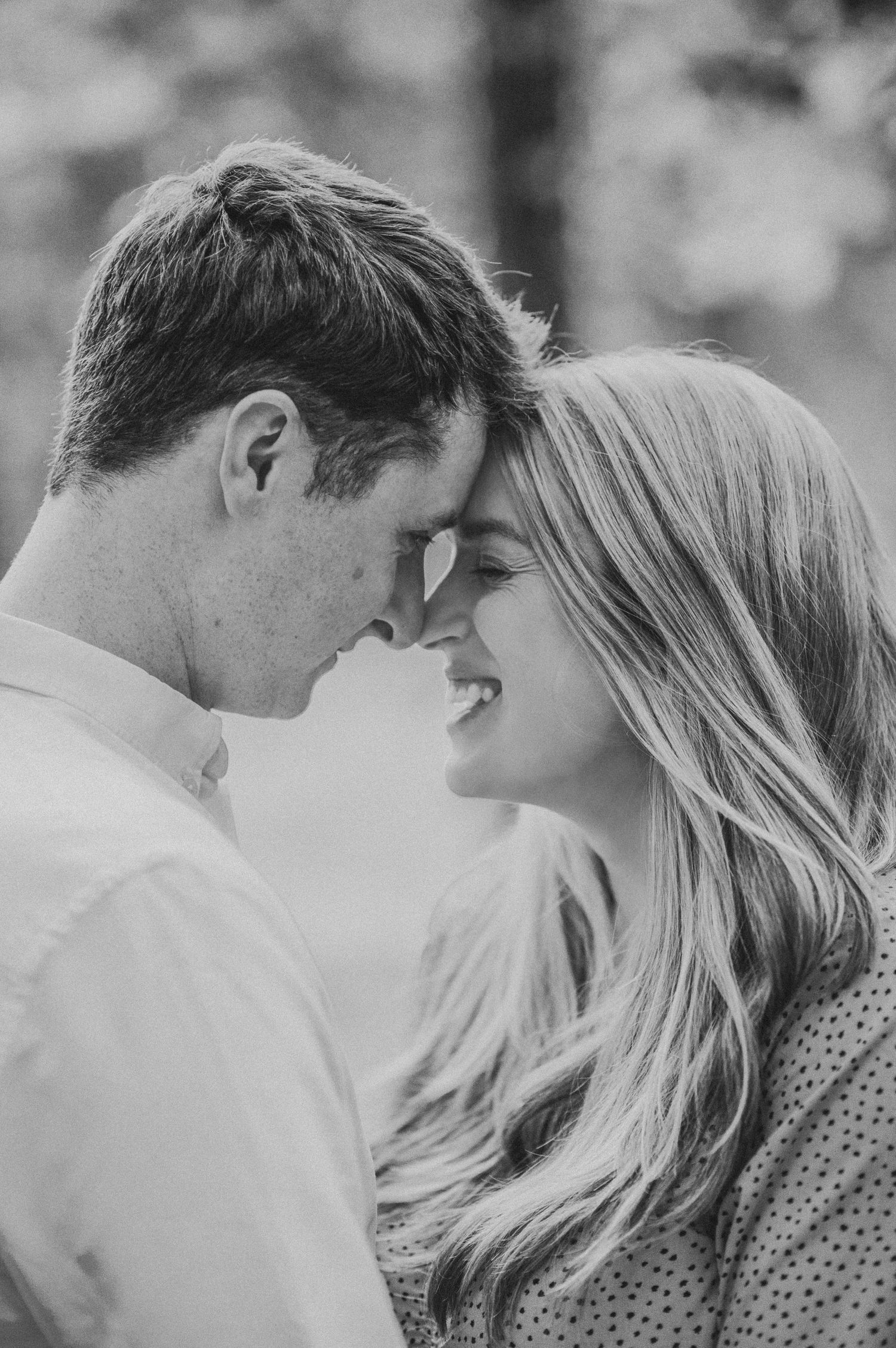 Black and white close-up of romantic poses in natural lighting.