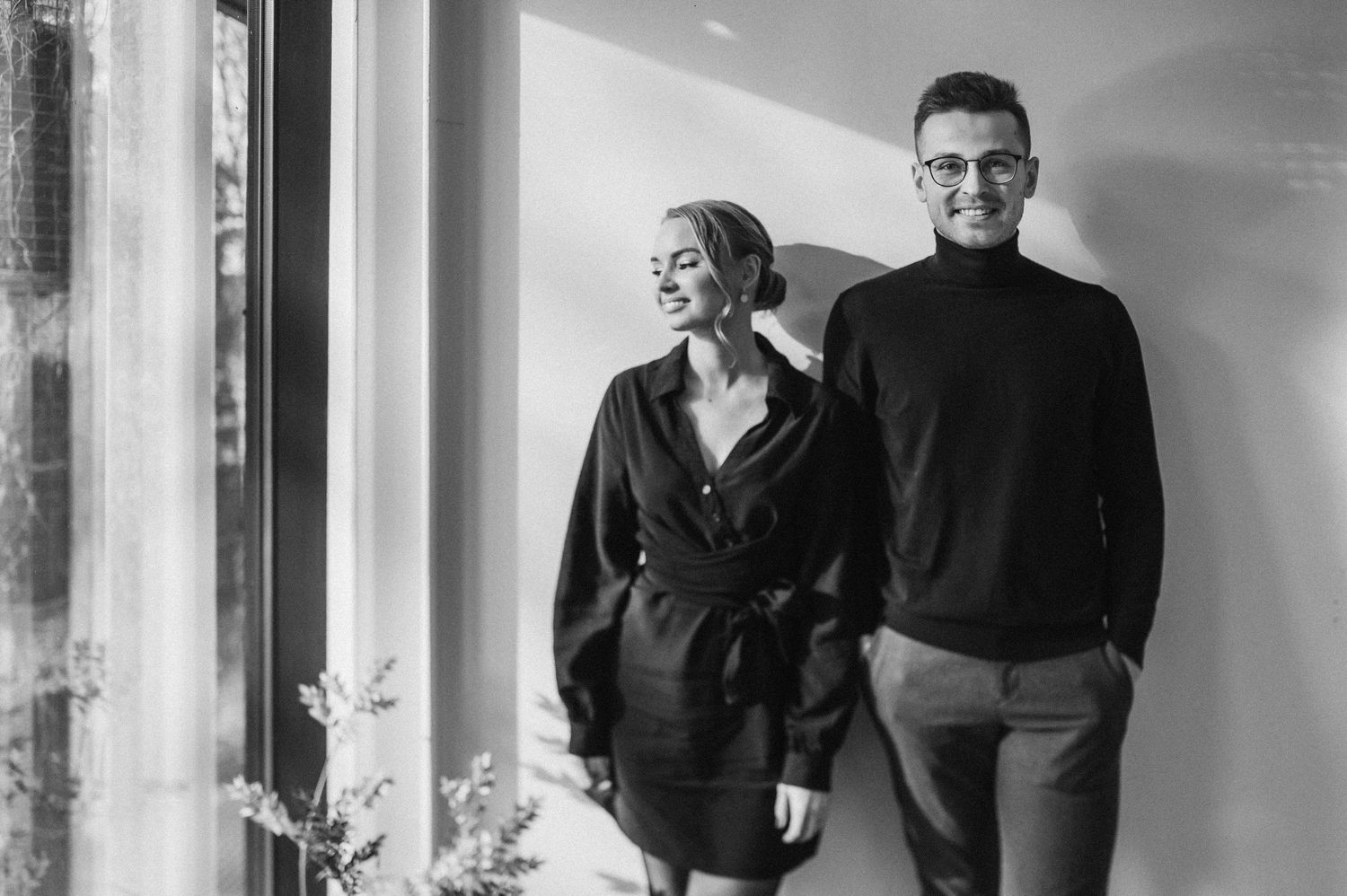 Black and white portraits showing natural interaction in contemporary interior space.