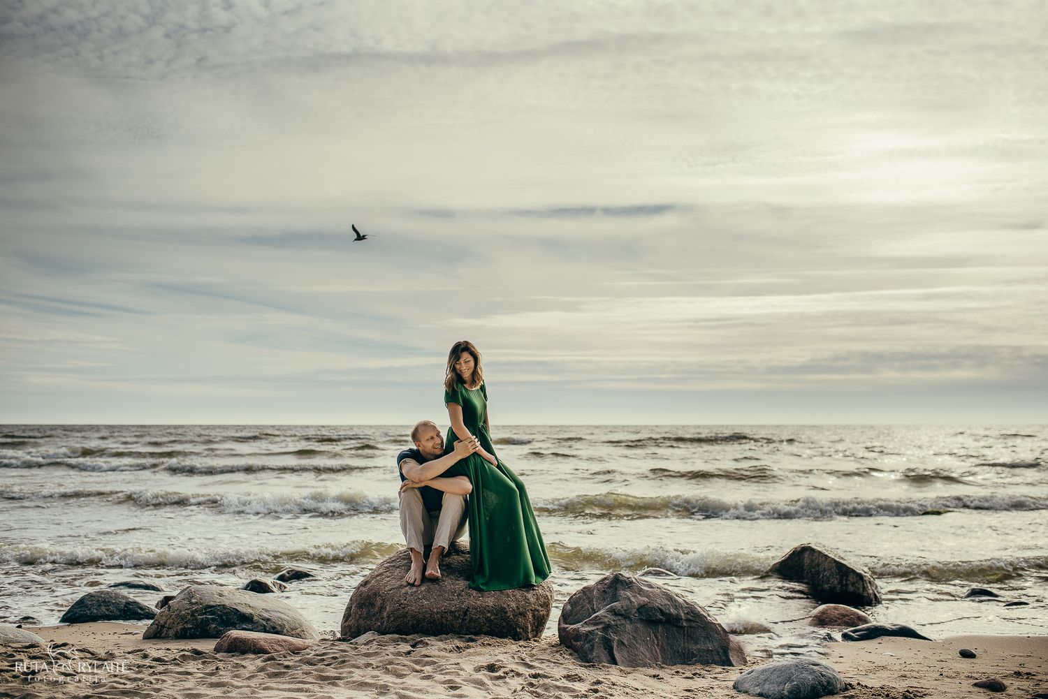 Scenic coastal images featuring rocks and waves along a misty beach shoreline.