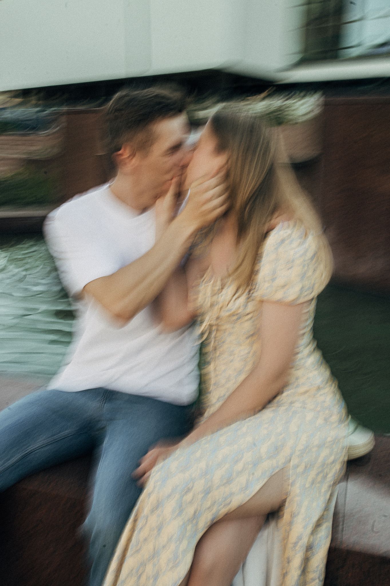 Motion blur capture of dancing figures in vintage-style clothing.