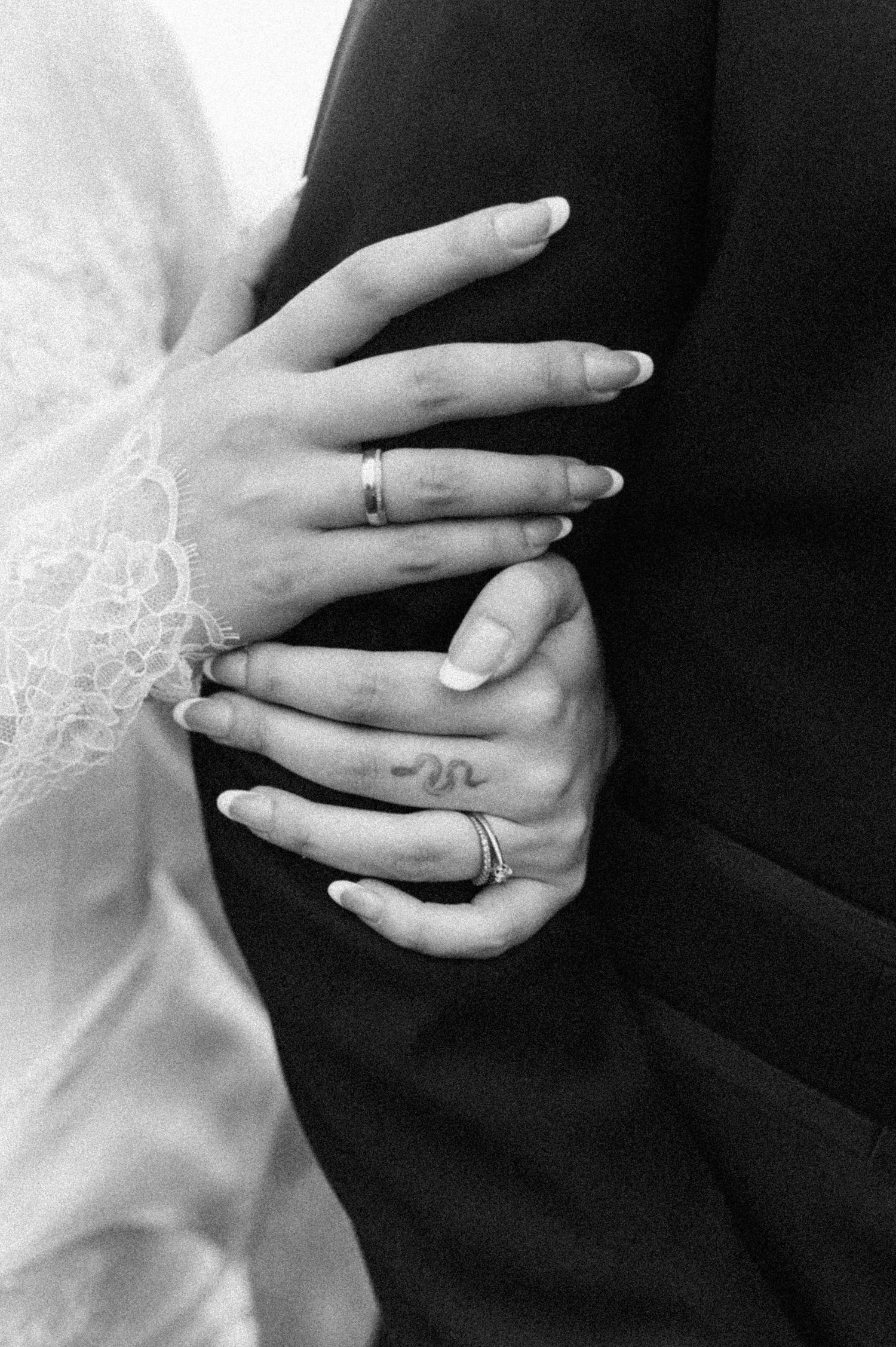 A series of black and white photos showing hands with wedding rings in various poses against dark backgrounds.