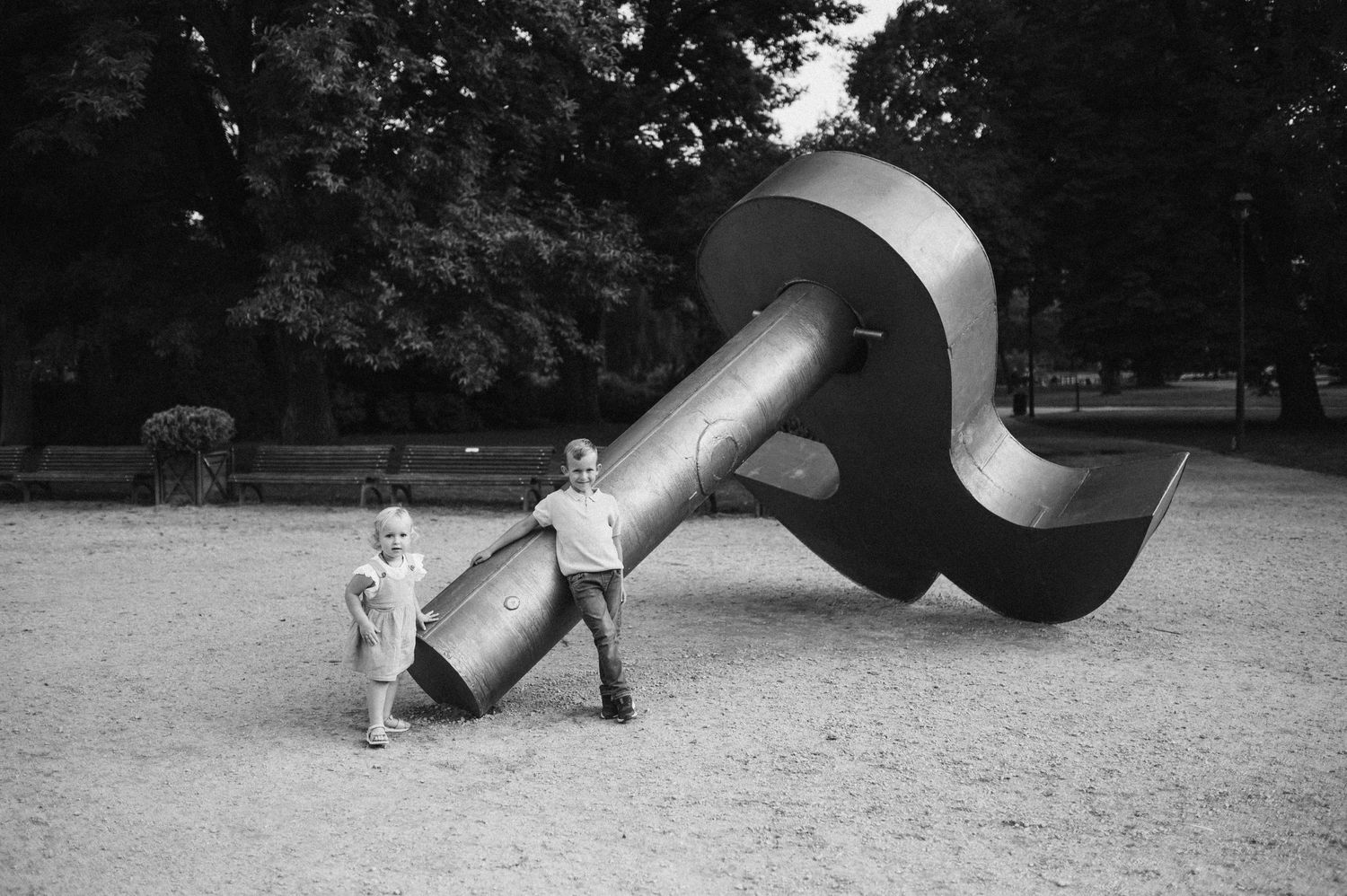 A playful outdoor photography sequence showing joyful moments in a park during a family photoshoot.