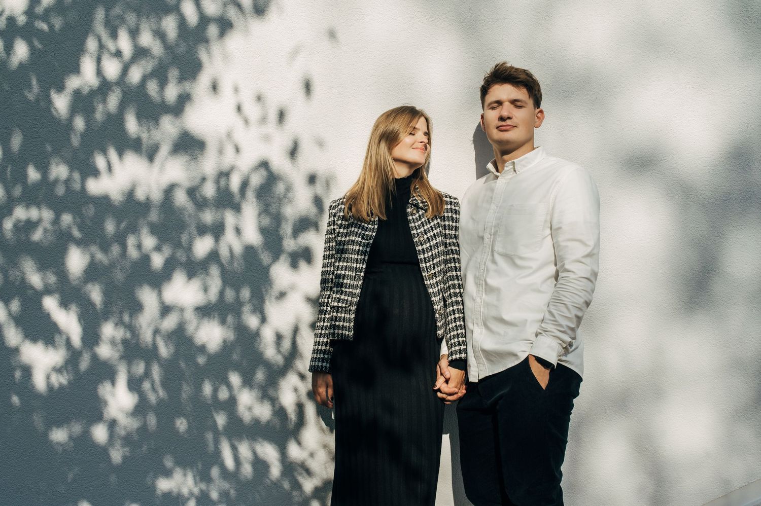 Romantic couple portraits with soft lighting and shadow effects.