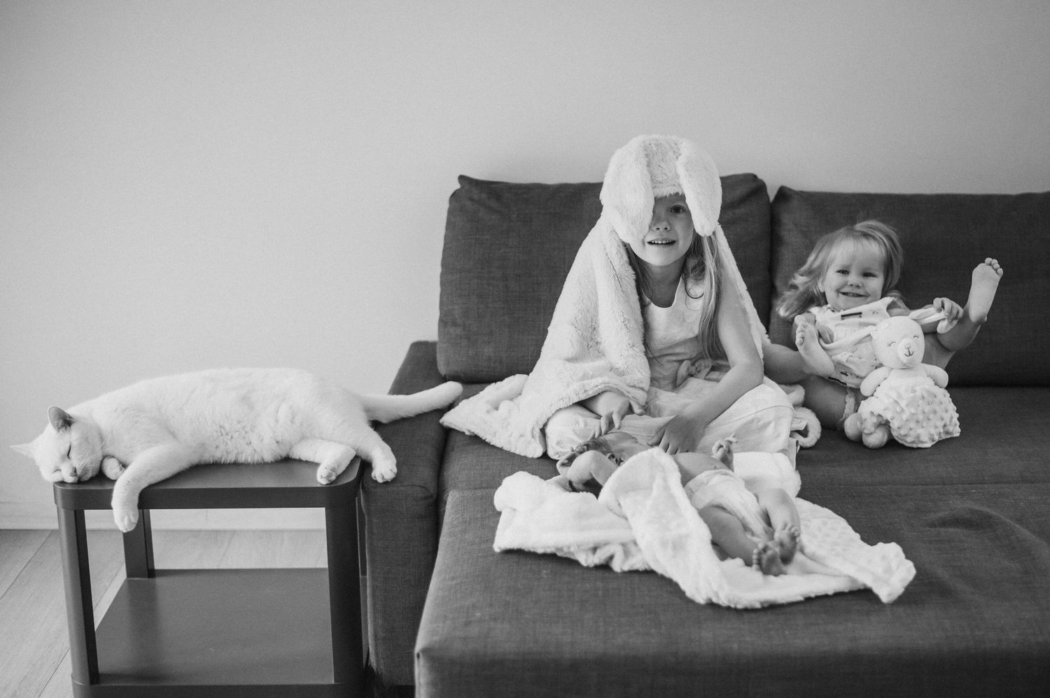 Candid black and white shots of quiet moments on furniture.