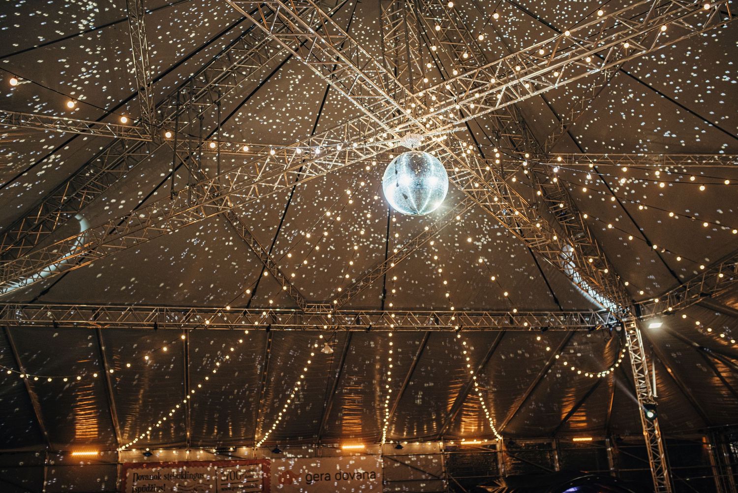 Ceiling decorated with twinkling string lights creating a magical starlit effect.