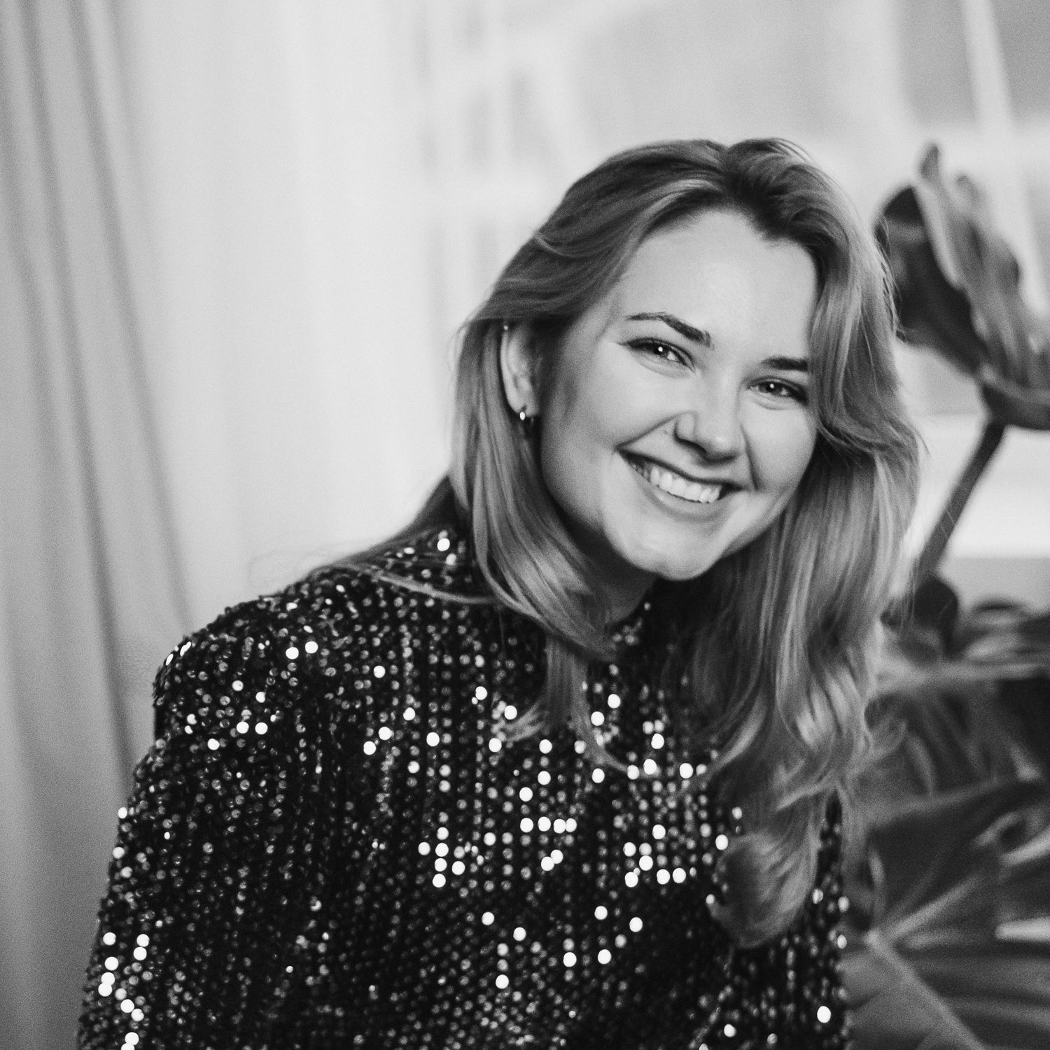 Black and white portraits showing expressions in a sparkly sequined outfit.