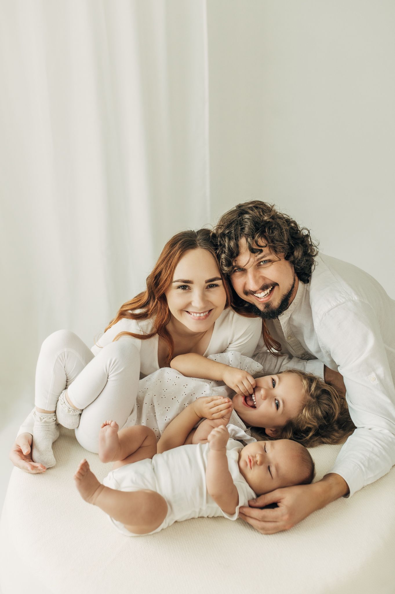 Family portrait series showing tender moments together on white background.