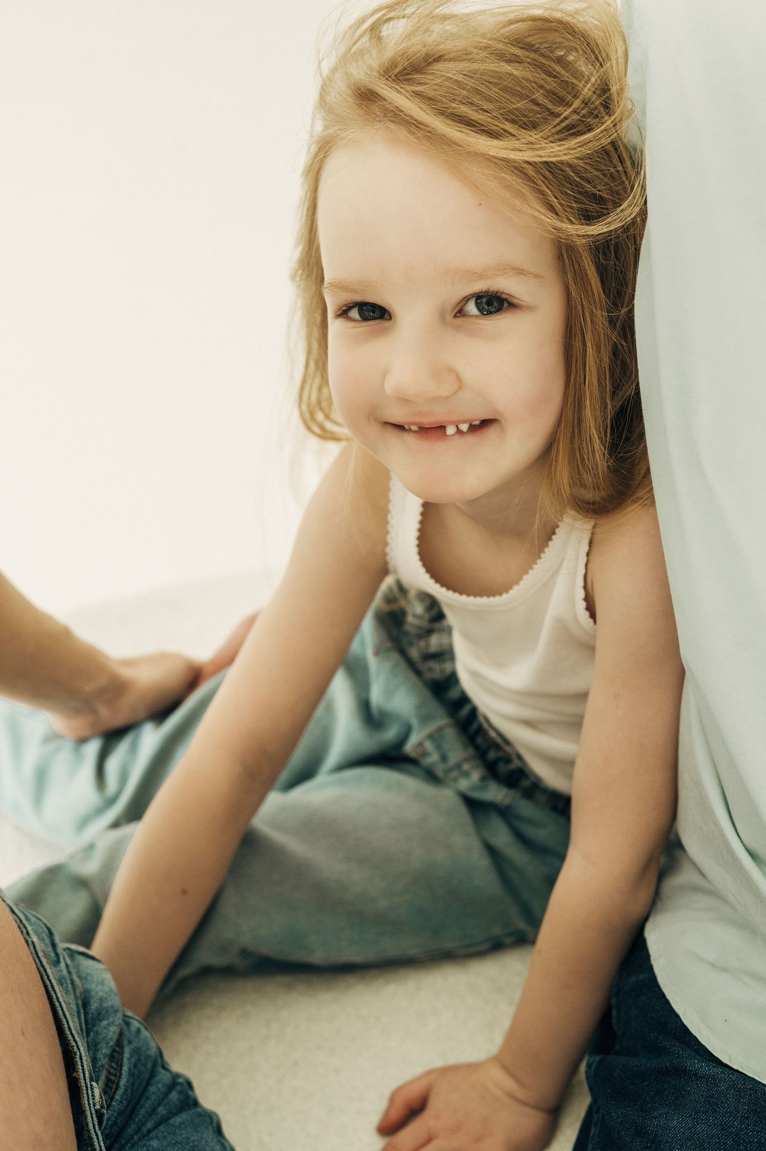 Candid close-up portrait series showing joyful expressions and playful moments.