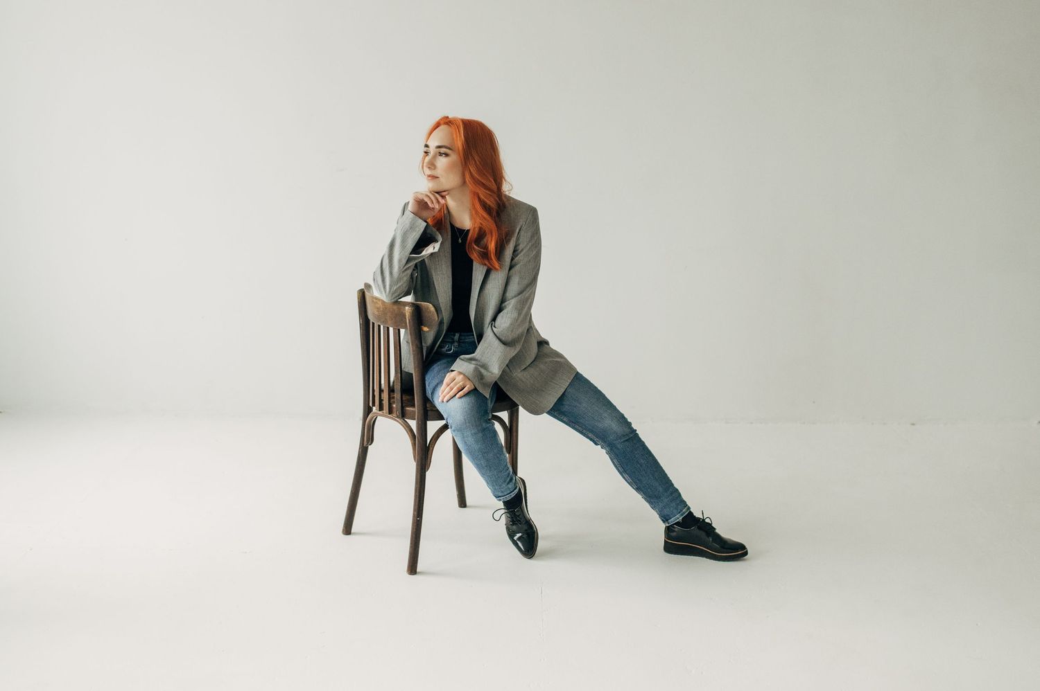 Artistic portraits showing relaxed poses on a chair against white background.