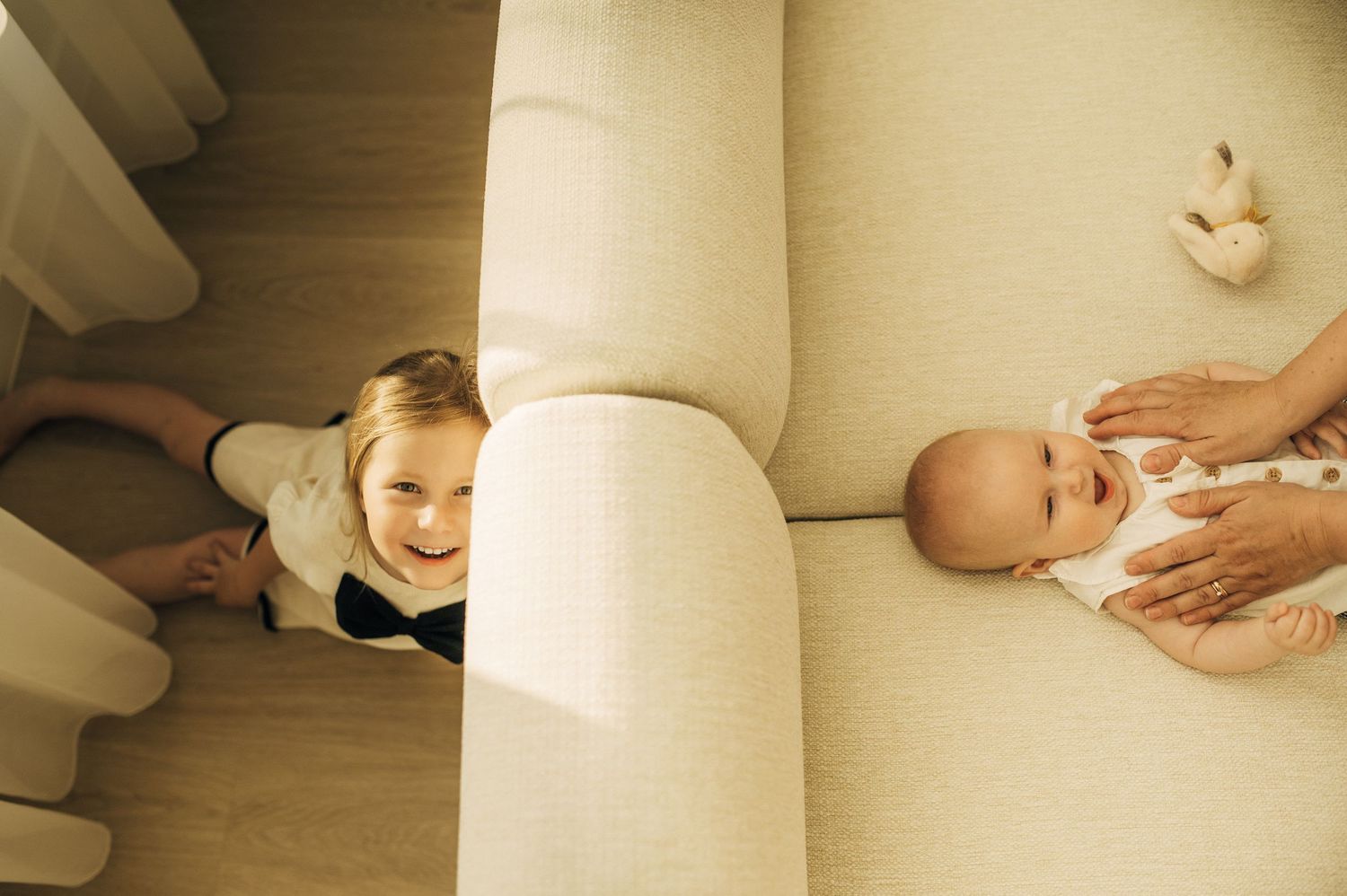 Series of photos showing gentle interaction between parent and child on light floor.