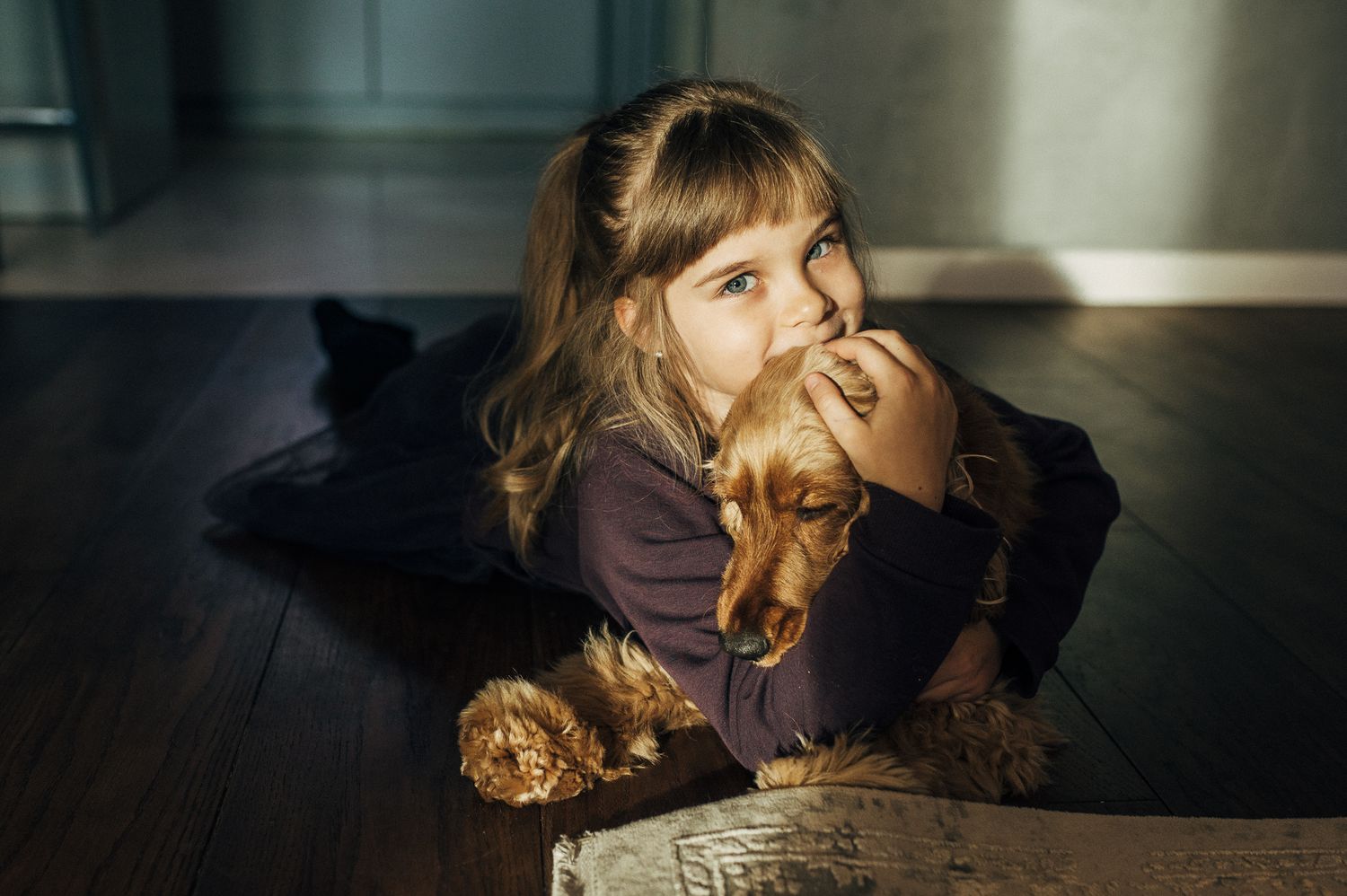 Indoor portrait series showing playful expressions and dramatic lighting.
