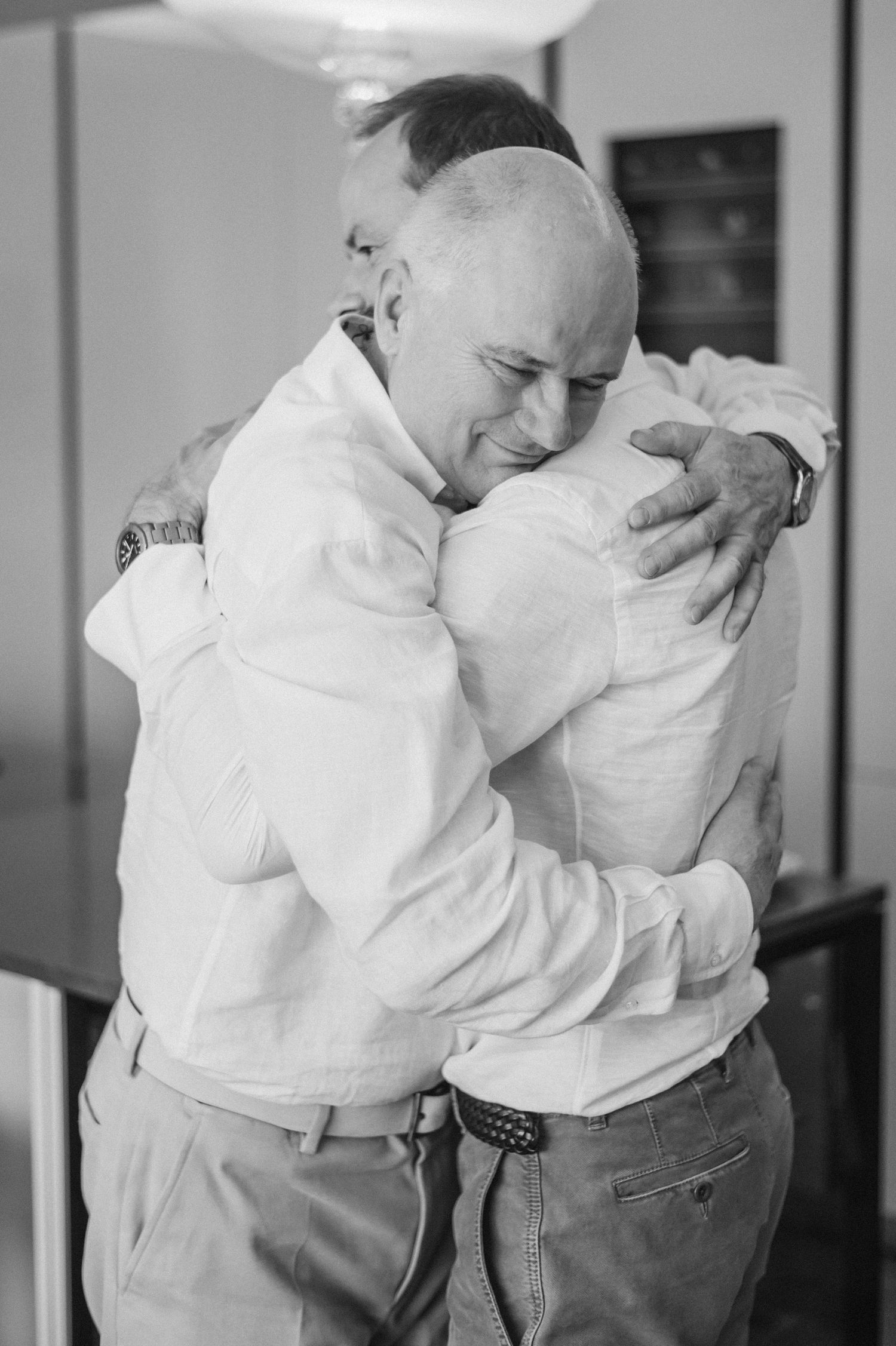 Black and white emotional embrace showing tender moment between two people.