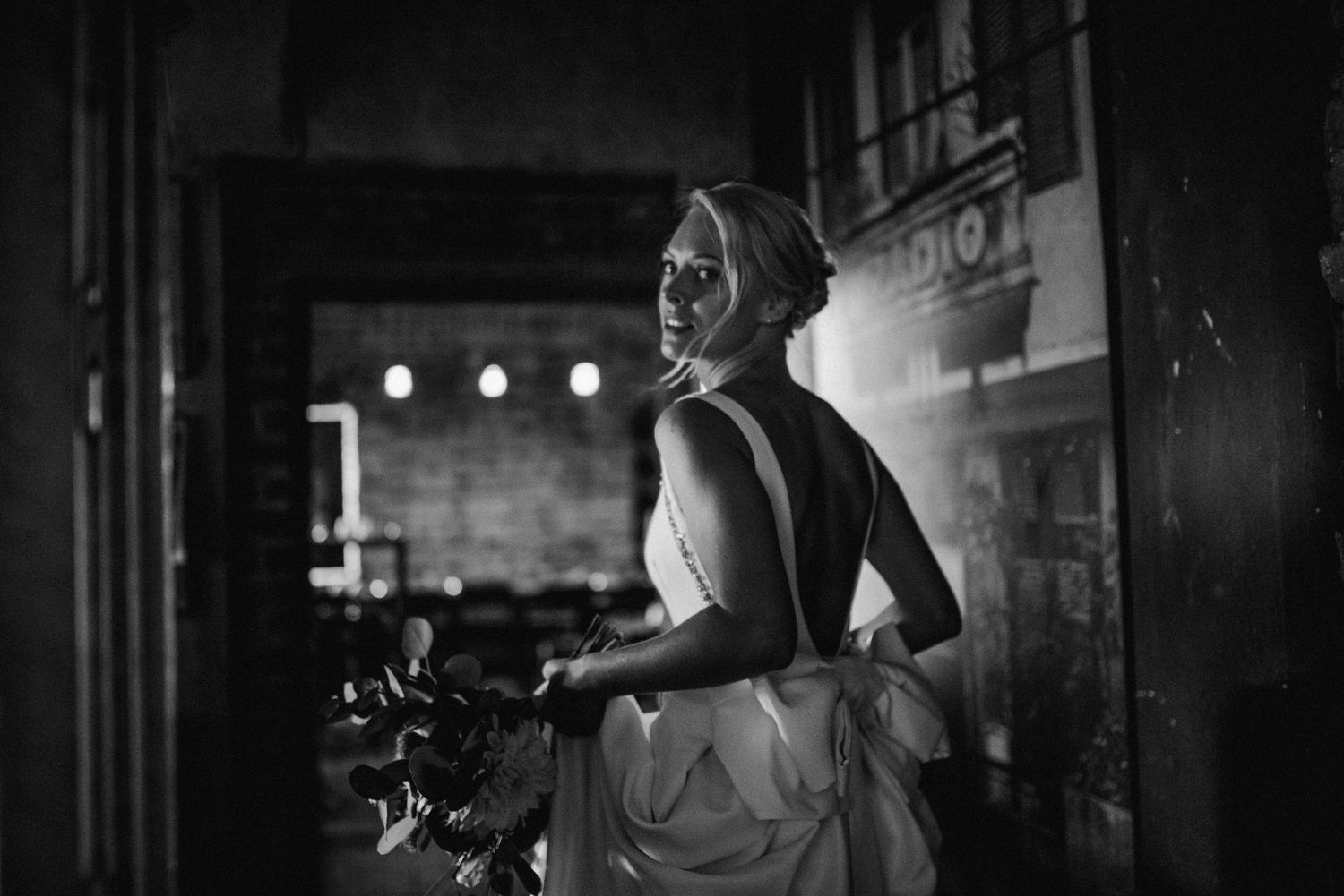 Moody black and white photography of camera equipment in low light setting.