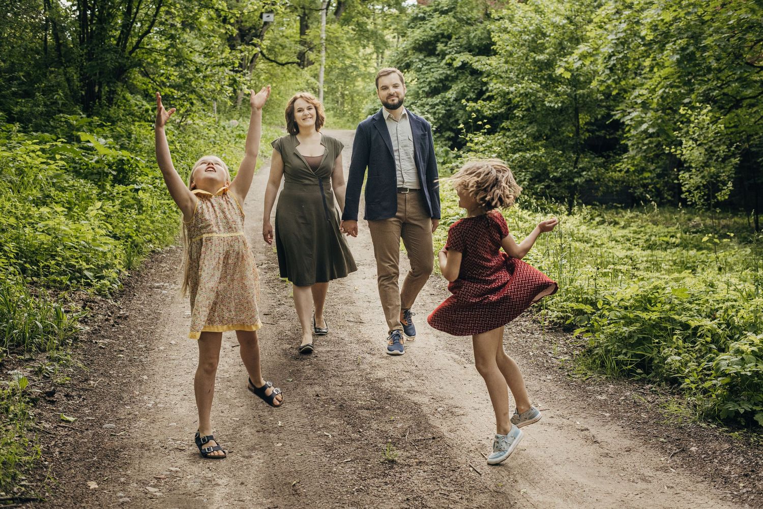 Lively outdoor sequence showing carefree moments along a wooded trail.