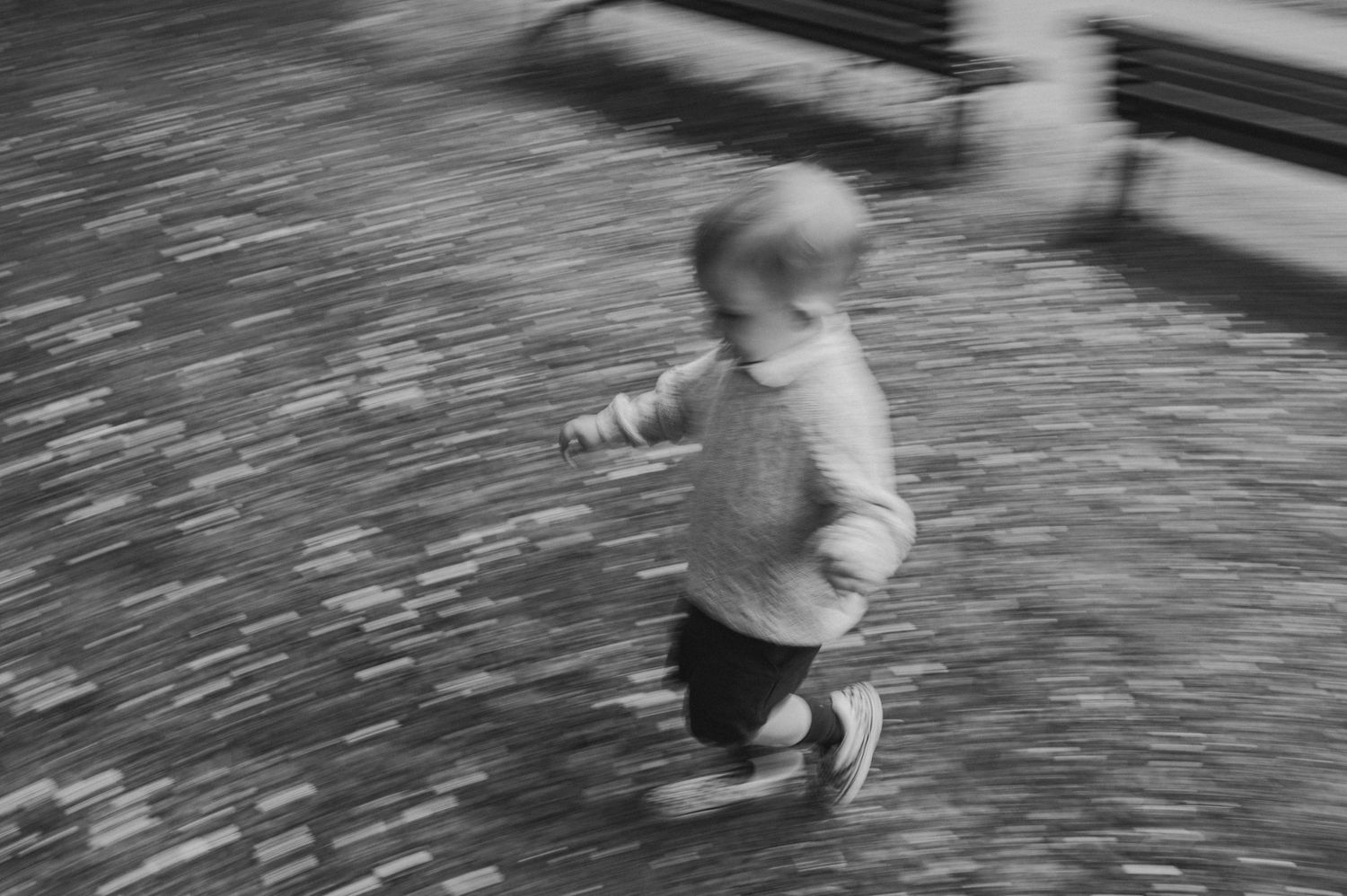 Series of motion blur images showing running movement on a stone path.