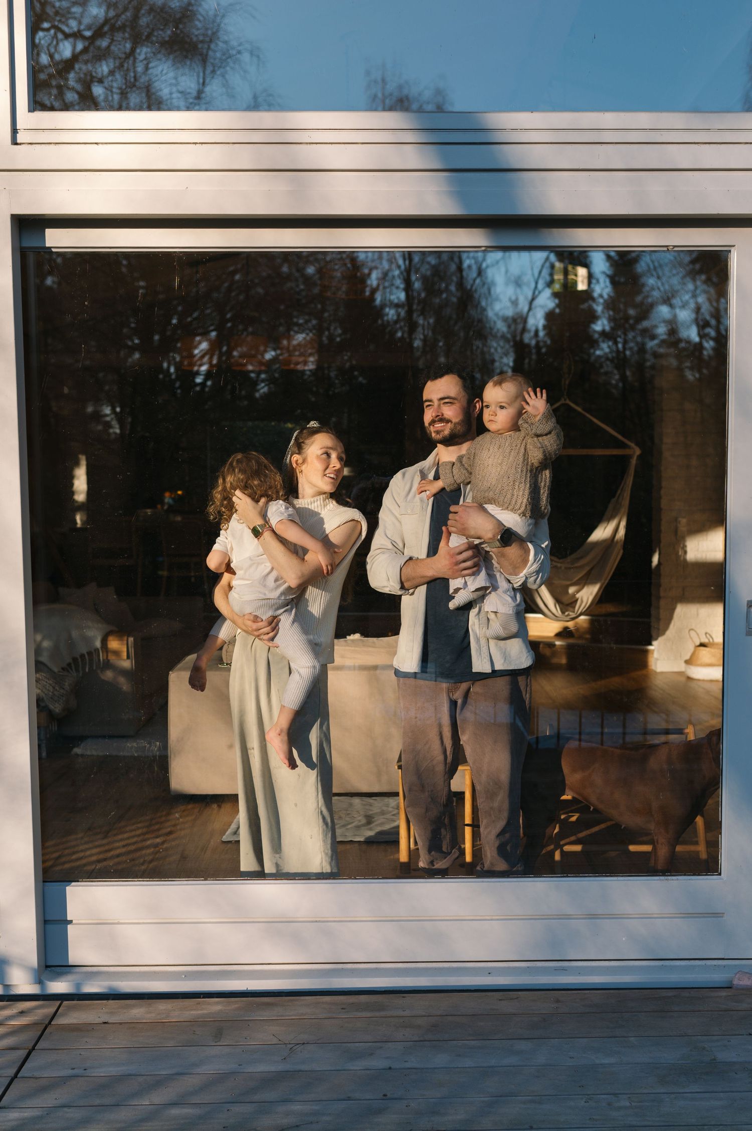 Three window panels display dancers in white outfits performing graceful movements in warm sunlight.