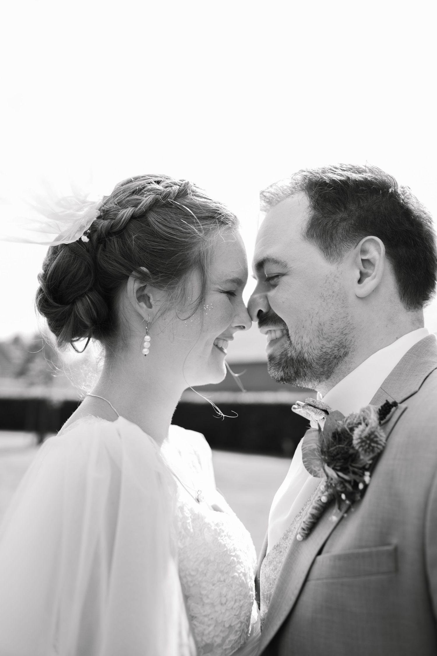 Black and white photo series showing tender romantic moments between a bride and groom on their wedding day.