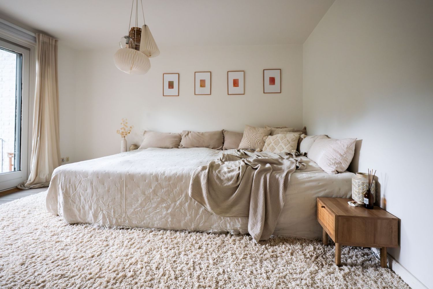 Cozy neutral bedroom interior with beige bedding, natural light, and minimalist decor displayed in multiple angles.