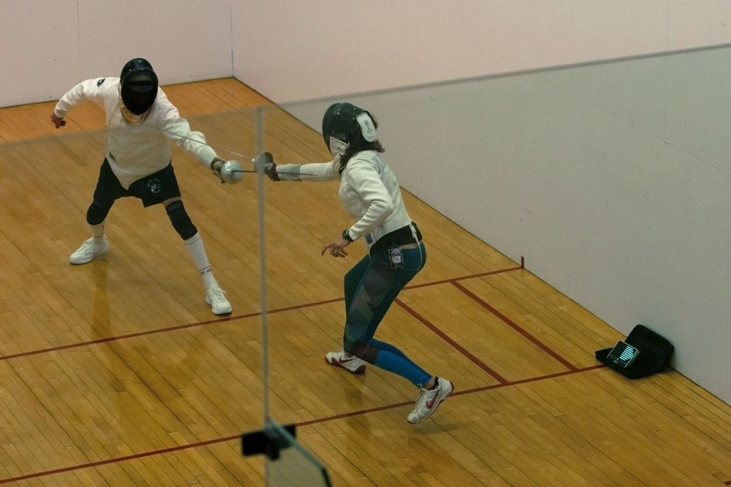Emma Buckingham fences against Rick Stephens on Sept. 7, 2024, after fencing club ended in Columbia, Mo.