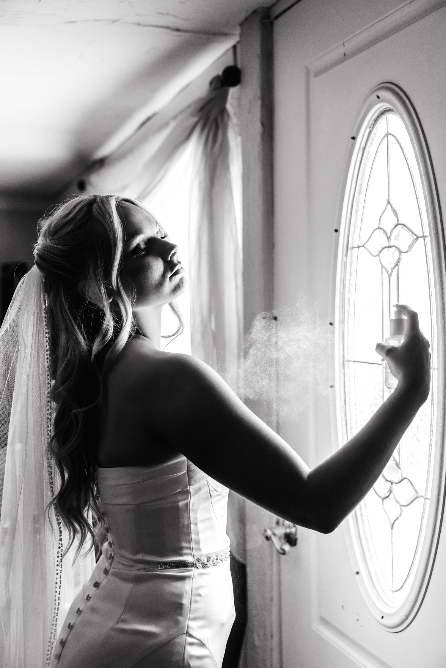 A series of black and white artistic photos showing a figure in silhouette against bright oval windows.