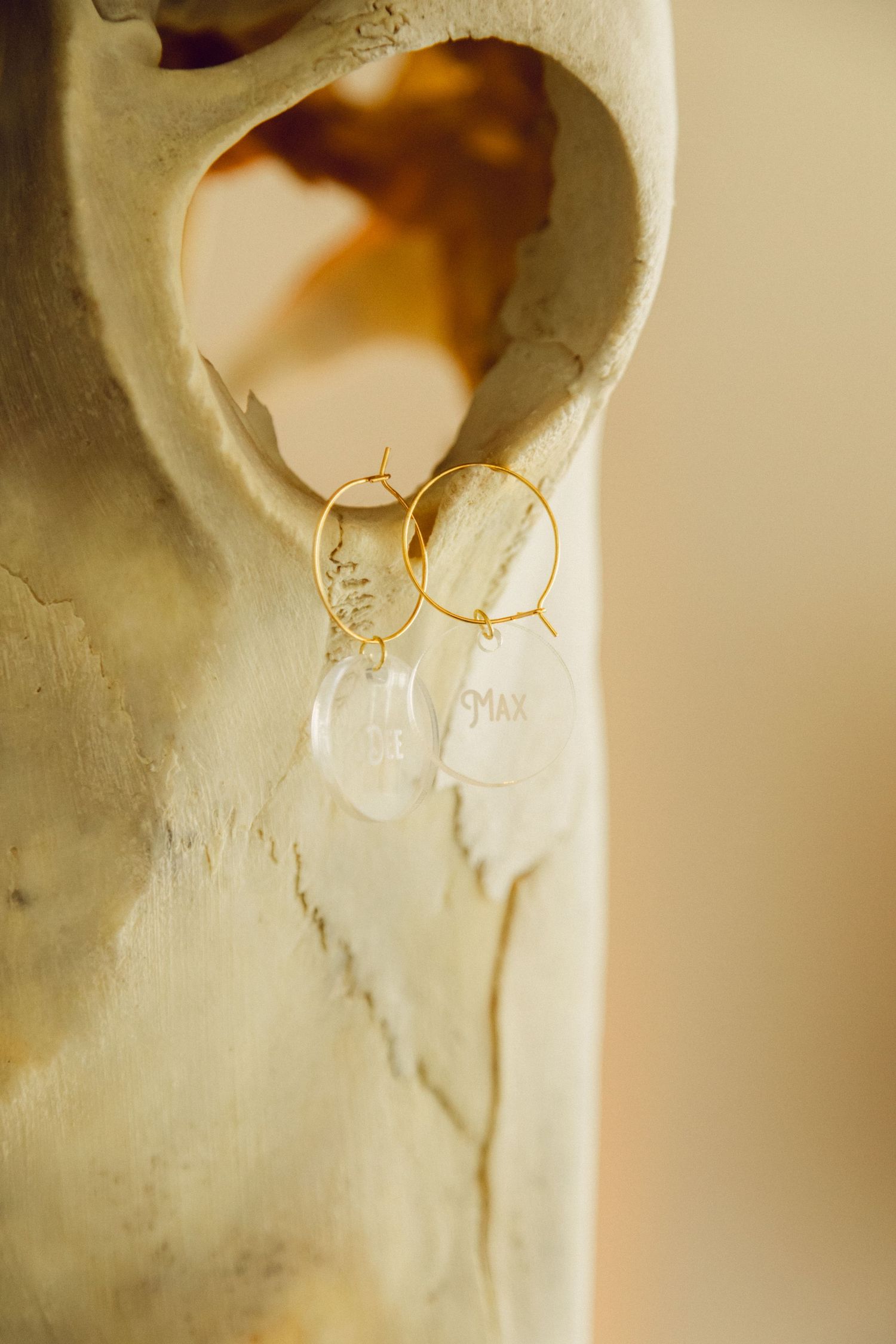 A series of white ceramic vessels with golden cracks showing the Japanese kintsugi repair technique.