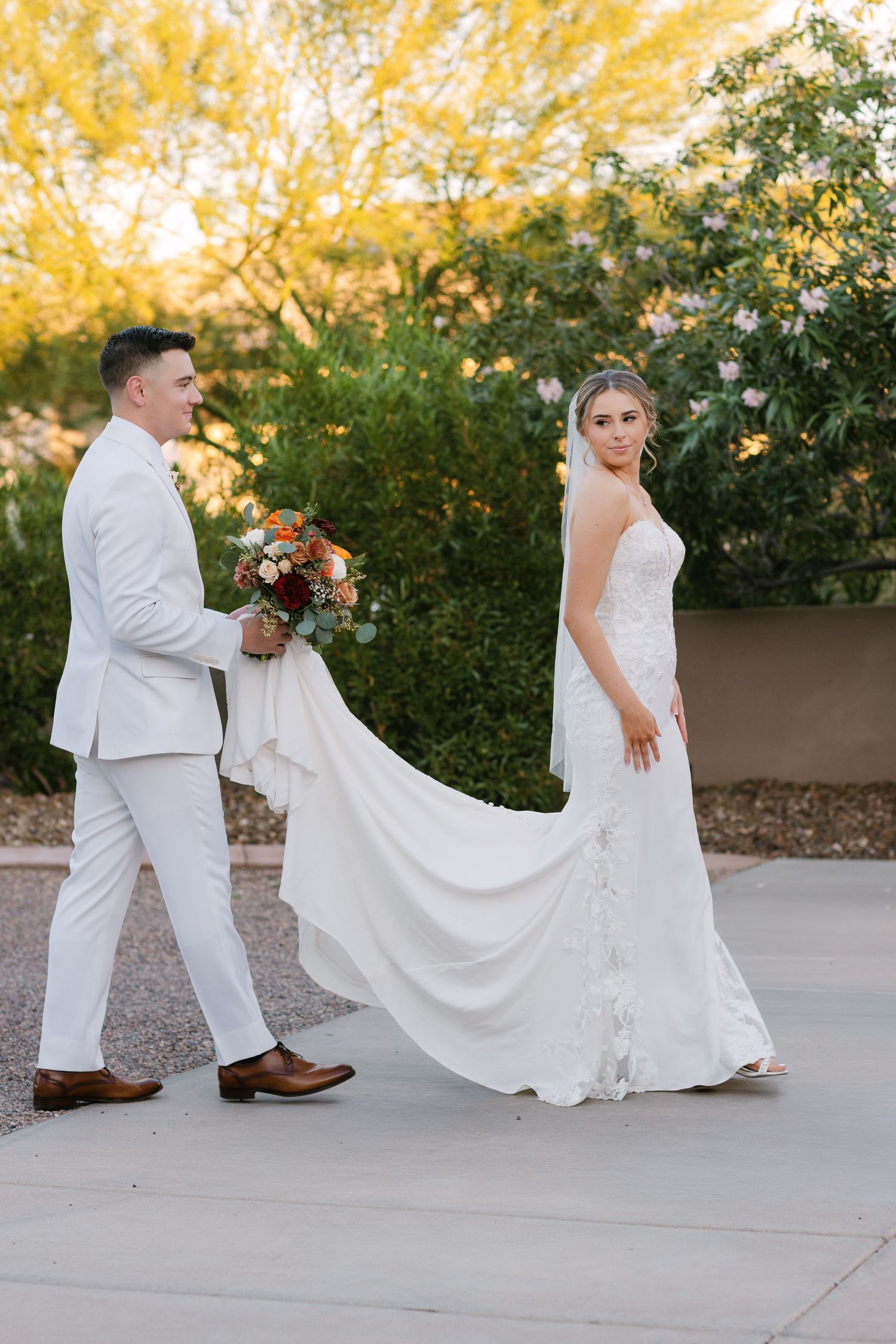 A series of playful wedding photos showing the couple walking and twirling in white attire against a sunset garden backdrop.