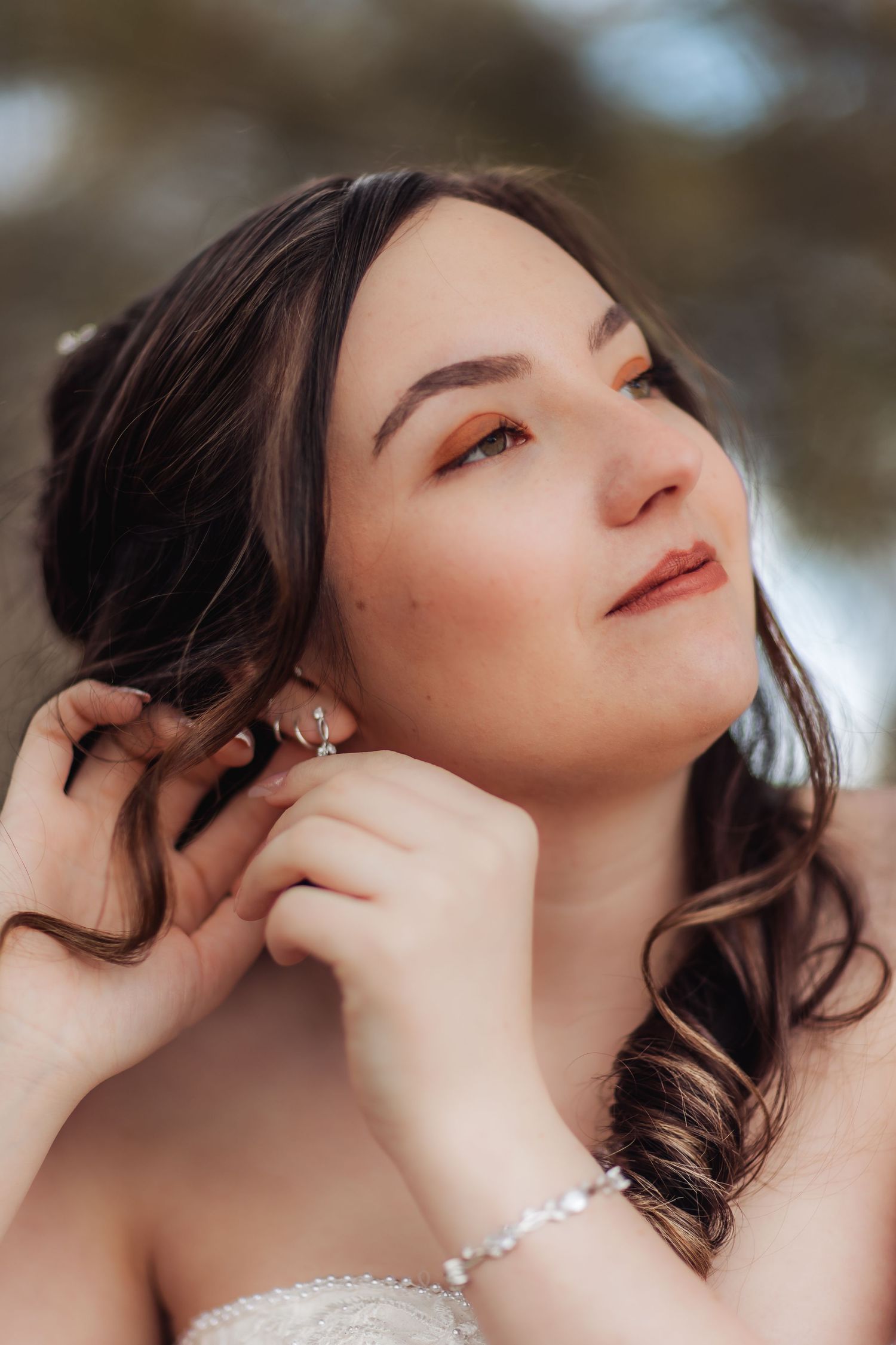 A series of dreamy profile portraits showing someone with dark hair tilting their head back in soft lighting.
