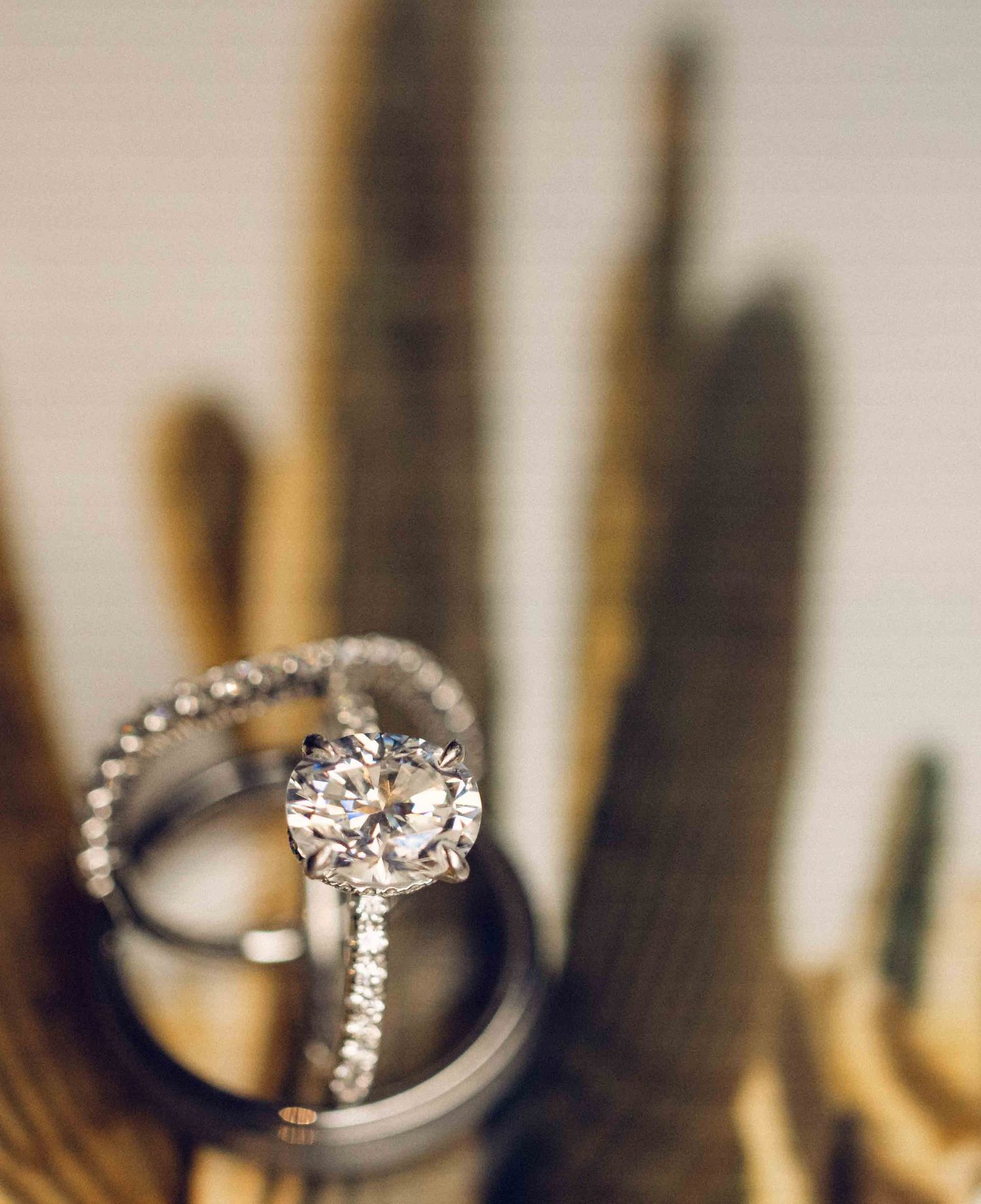 A sparkling diamond engagement ring shown in a series of close-up shots with varying focus and angles.