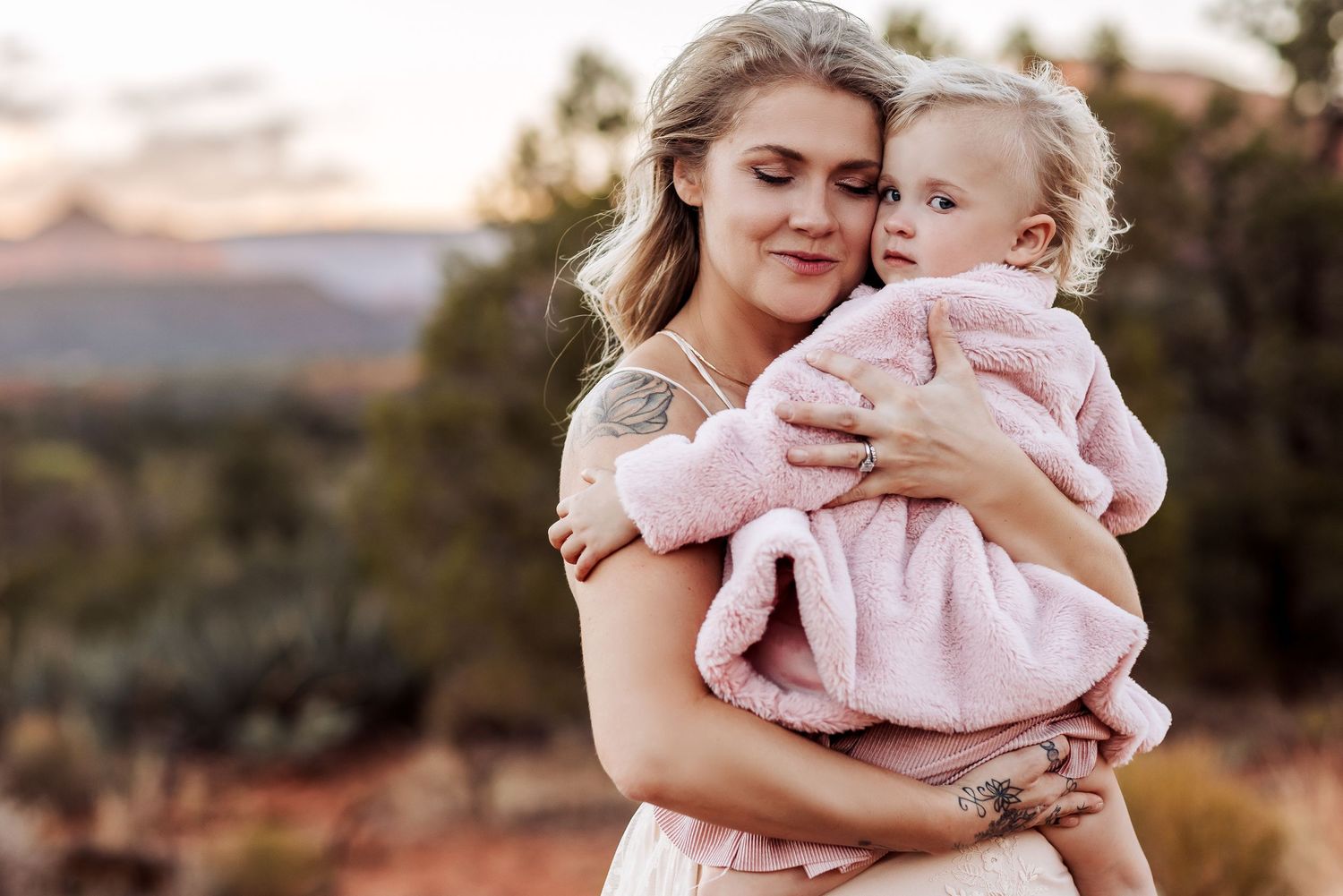 Parent and child share tender moments outdoors at sunset in a series of connected lifestyle portraits.