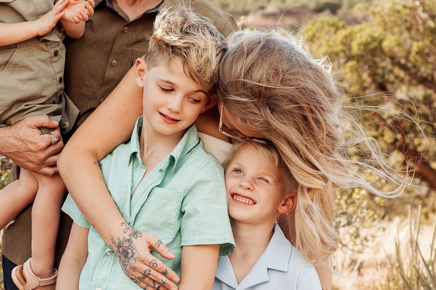 A joyful family moment captured in a series of candid outdoor photos with warm autumn colors and natural lighting.