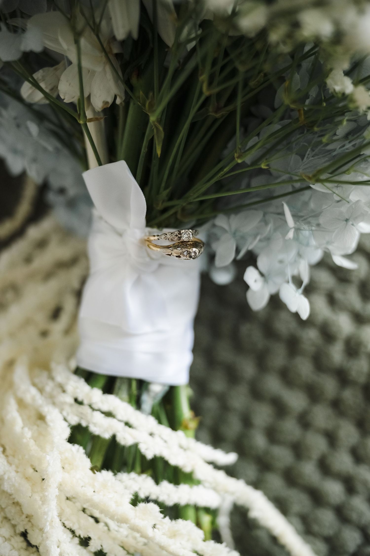 Wedding rings tied with white ribbon to a bouquet featuring white flowers and greenery.
Clare Valley
South Australia
Wedding Photography