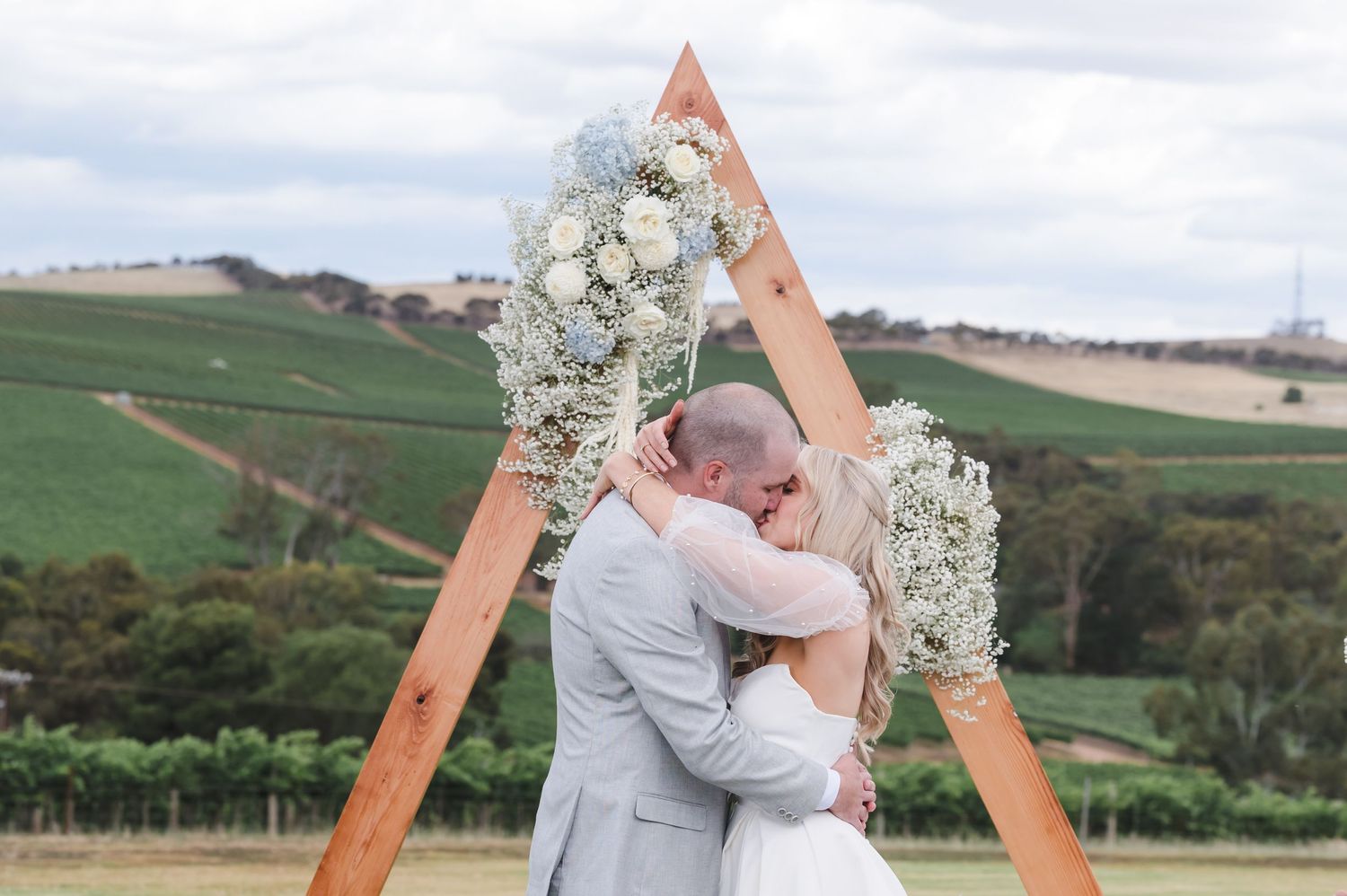 Wedding ceremony under a wooden triangle 
Clare Valley
South Australia
Wedding Photography