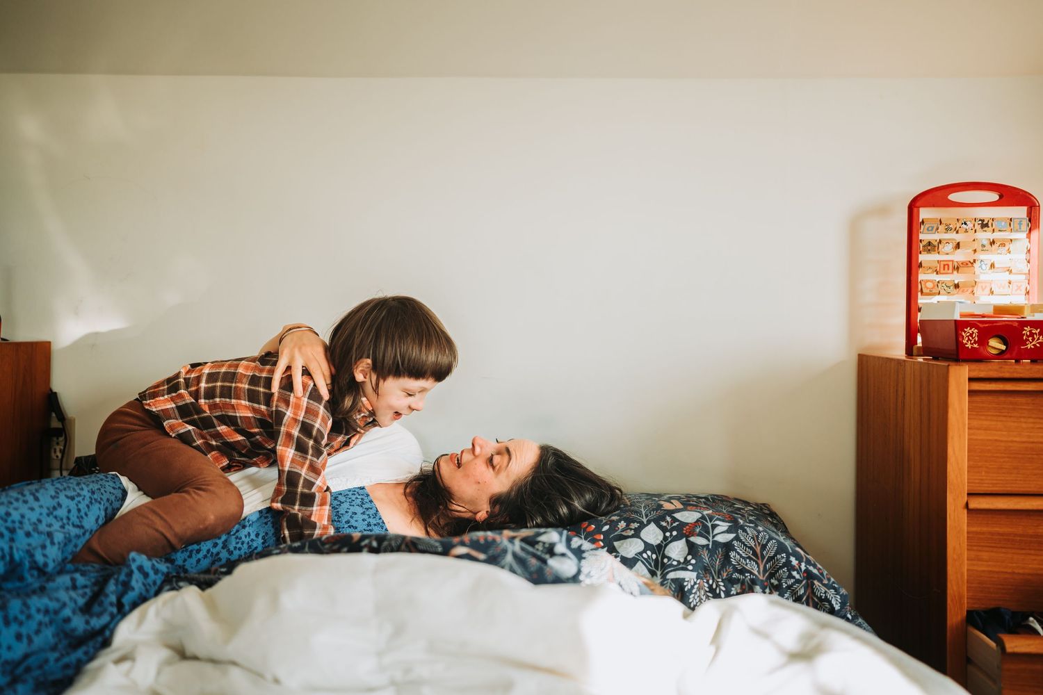 Series of connected photos showing someone tossing and turning throughout the night in bed with white bedding.