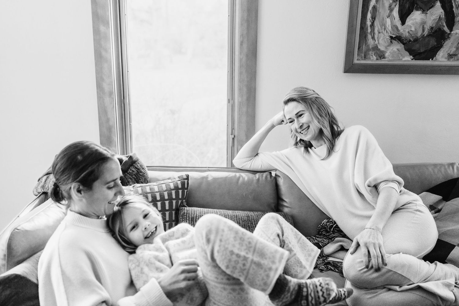 A series of black and white photographs showing intimate moments of reading and relaxation at home.
