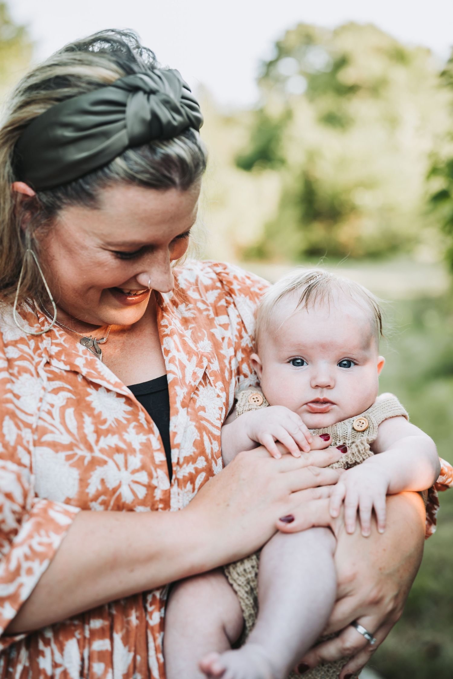 Gentle embraces and loving cuddles captured in a series of intimate outdoor family portraits.