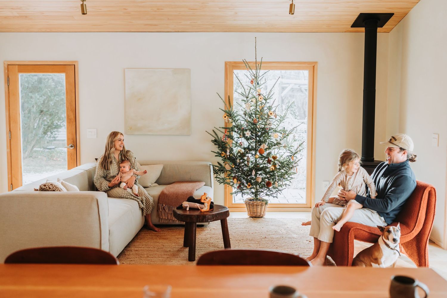 Collage of cozy interior scenes showing modern rustic living spaces with wood paneling and natural lighting.