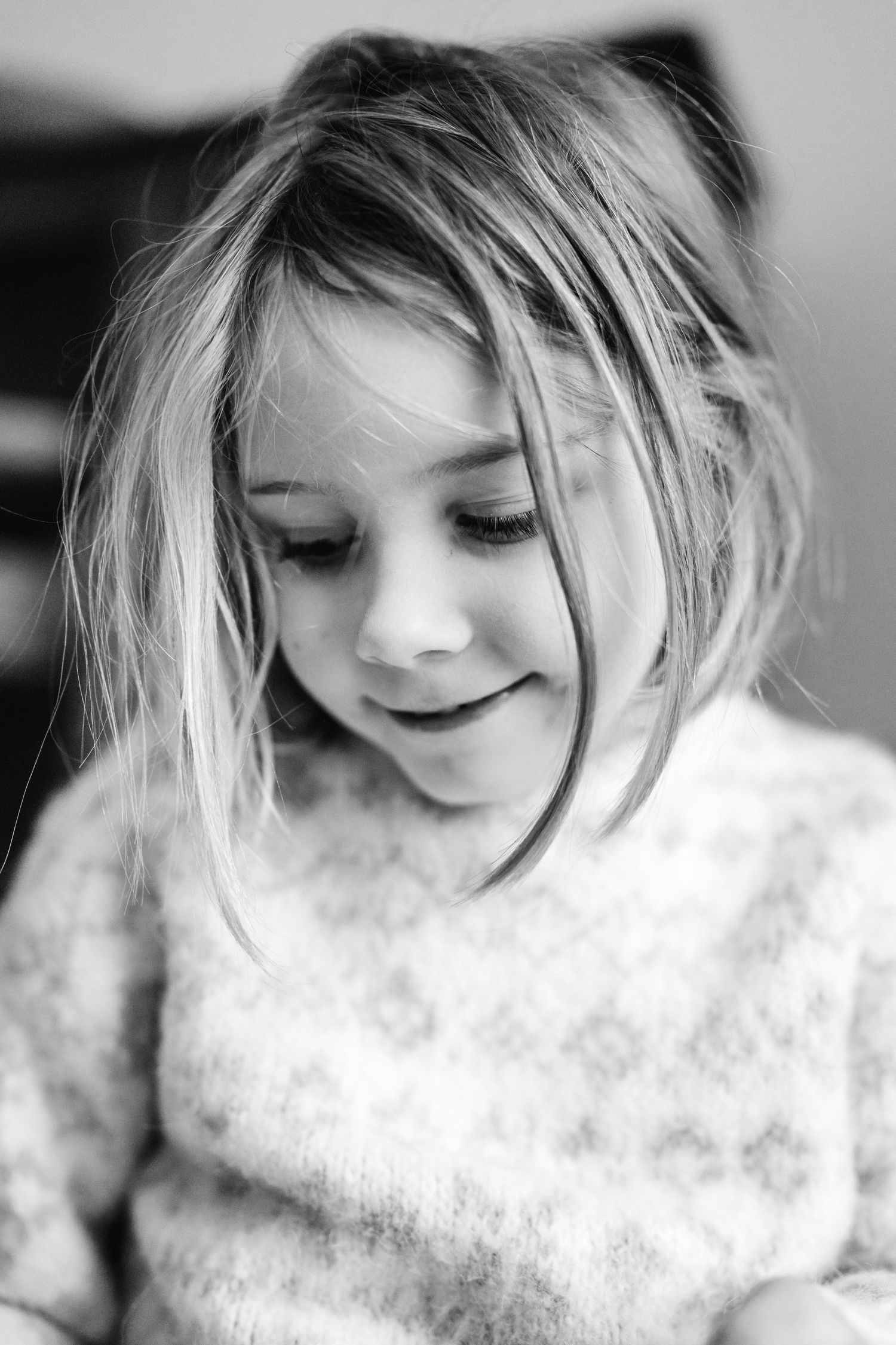 Black and white portrait series showing a dreamlike sequence of expressions and flowing movement in a delicate lace pattern.