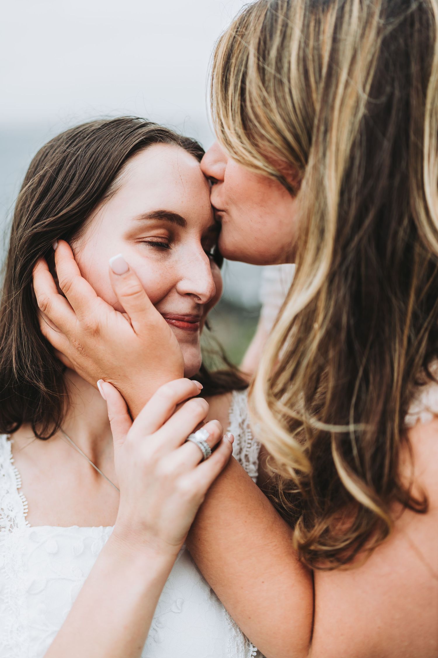 Intimate close-up portrait sequence showing tender romantic moments between two people in white attire.