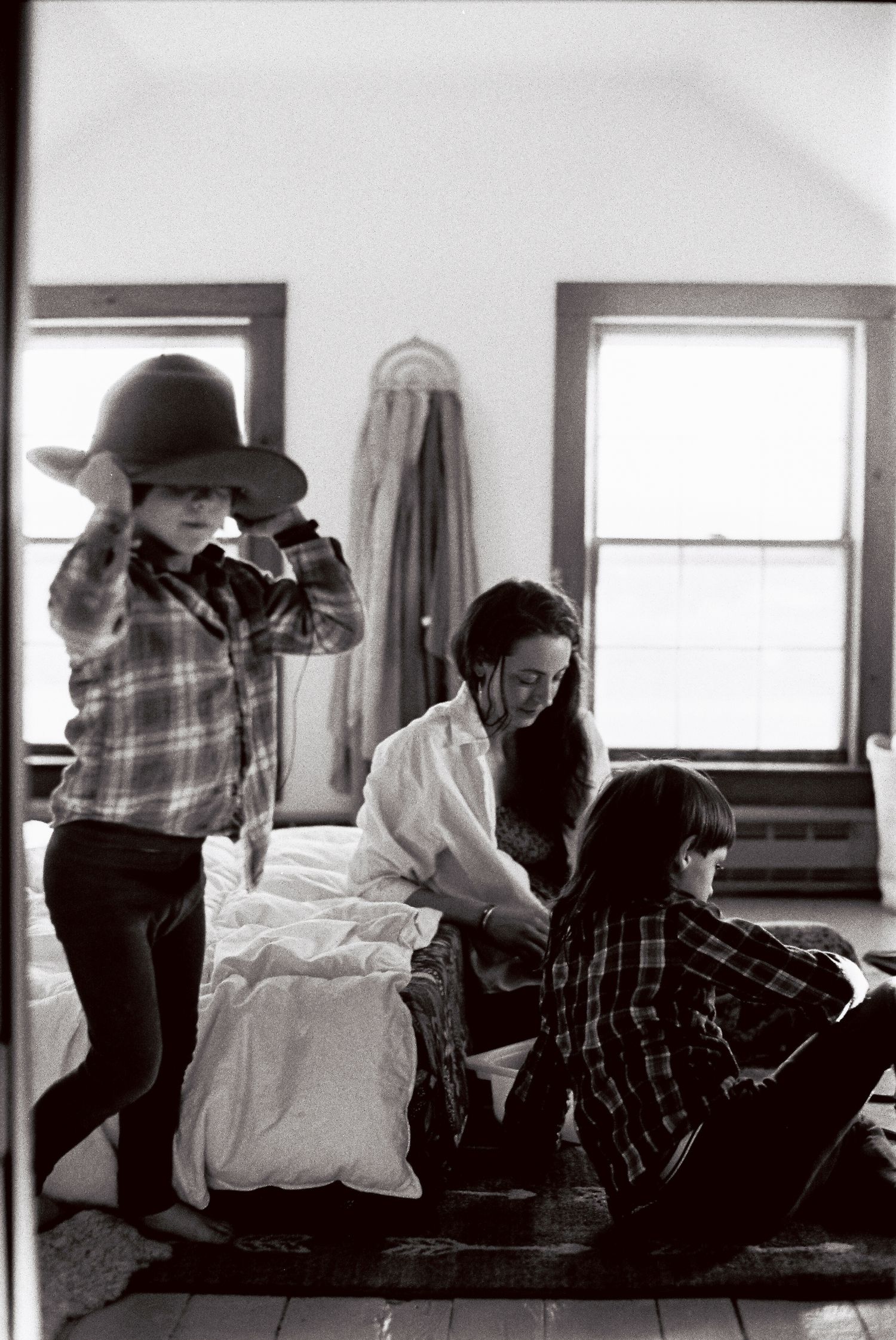 A black and white photo sequence showing two people in intimate conversation on a couch.