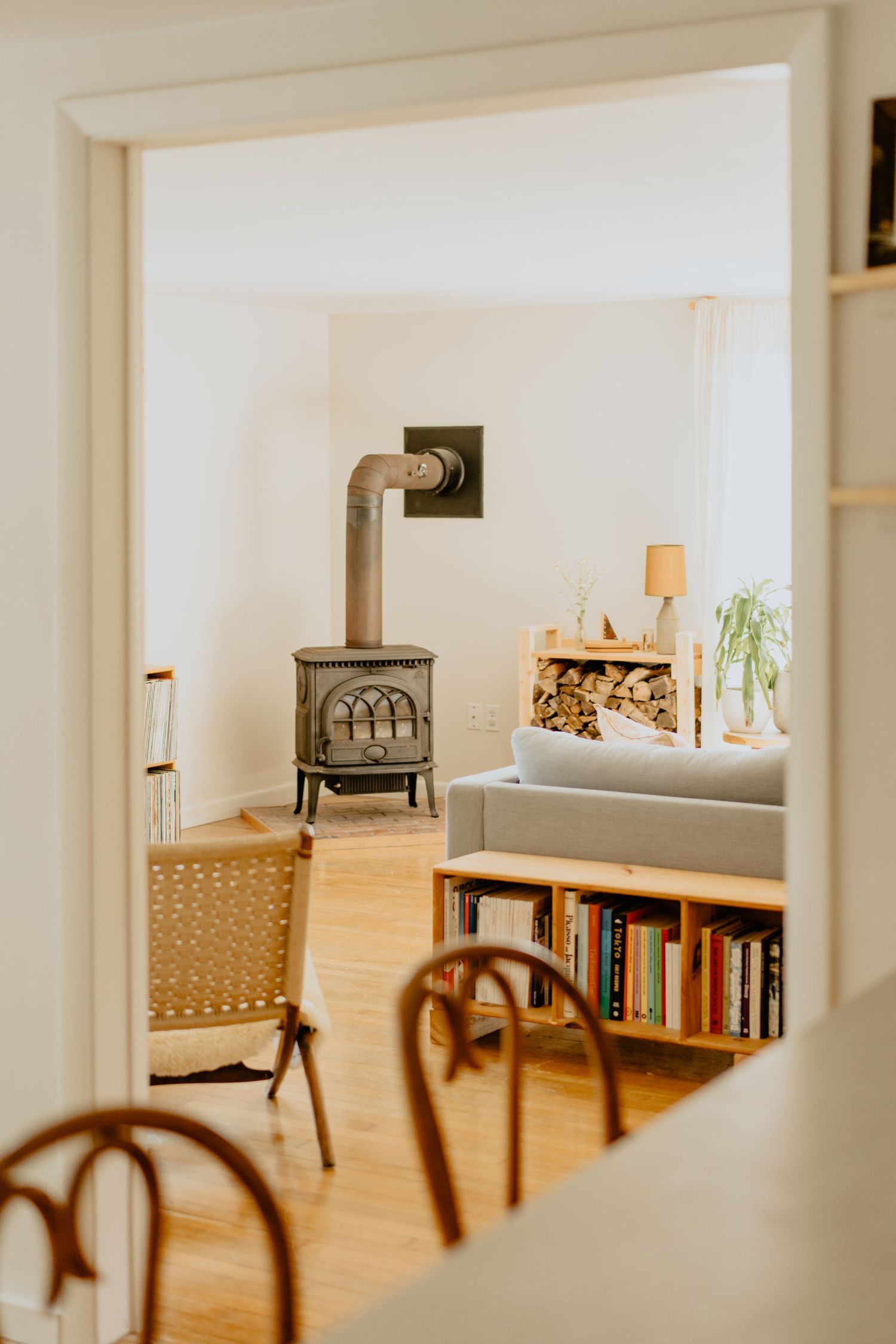 Open concept living space with wooden furniture and built-in bookshelves.