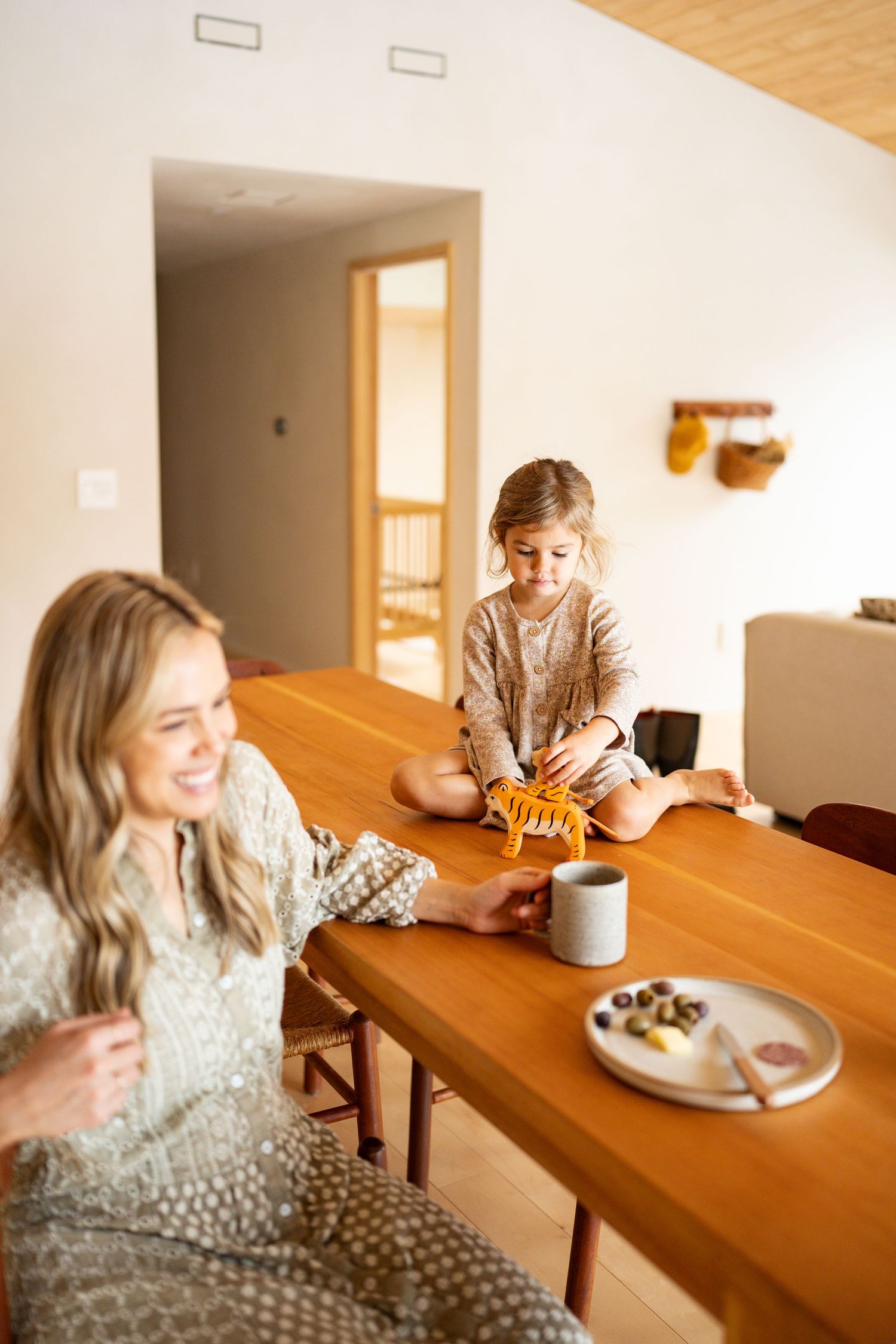 A series of candid shots show people enjoying coffee and snacks at a wooden counter in warm natural lighting.