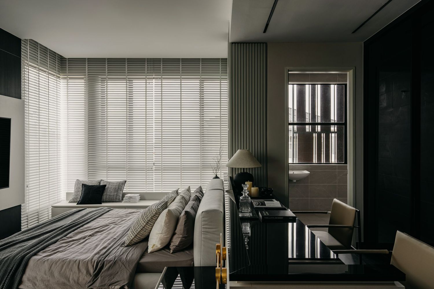 Minimalist bedroom design with horizontal blinds and dark accent walls creating a sophisticated ambiance.