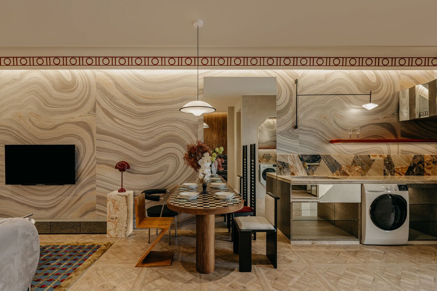 Modern apartment interior with curved wall patterns and integrated laundry area.