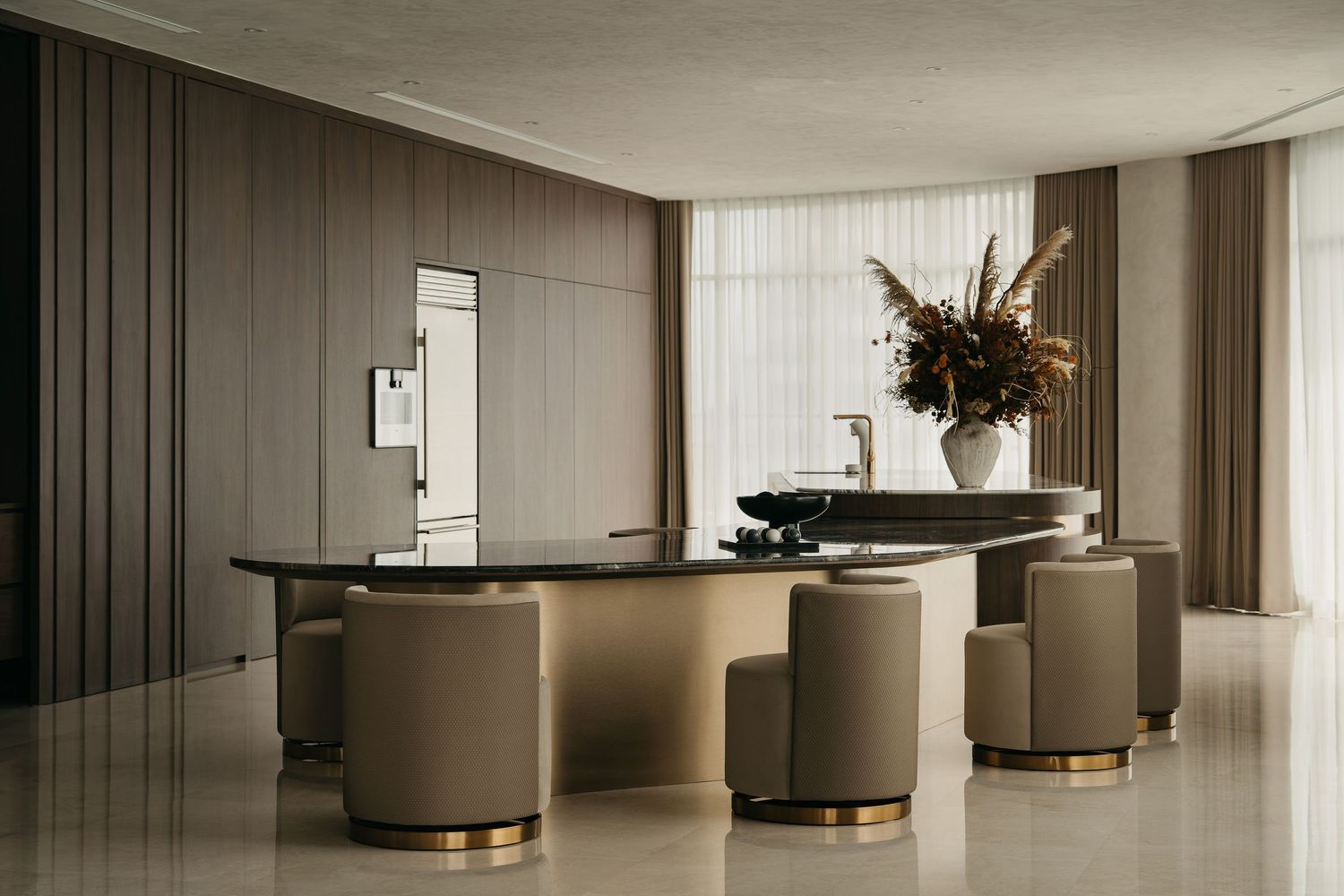 Modern minimalist living room interior with curved seating and soft beige tones in a luxurious open space design.