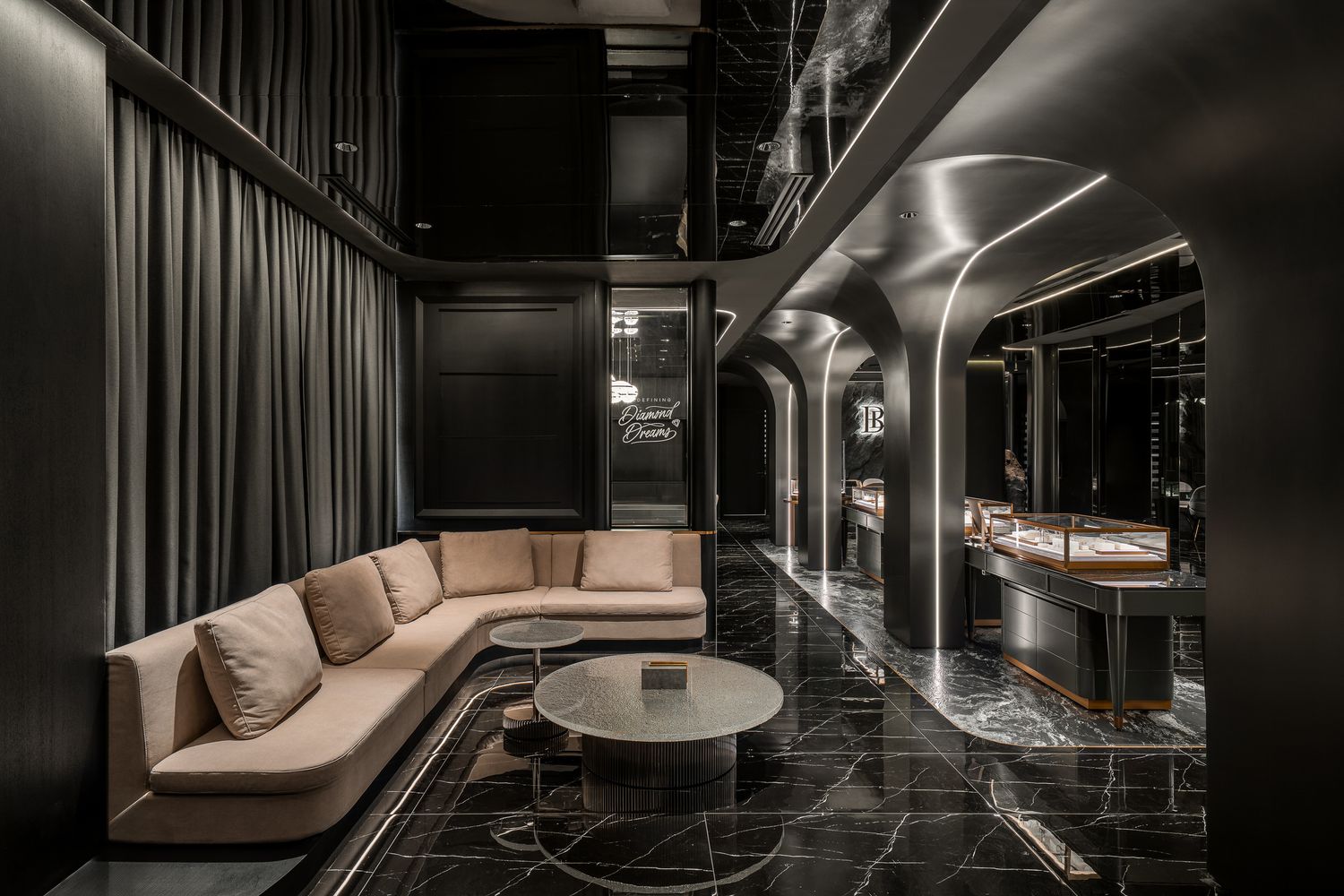 Modern spa interior with dark walls features sleek lounge seating and ambient lighting creating a luxurious atmosphere.