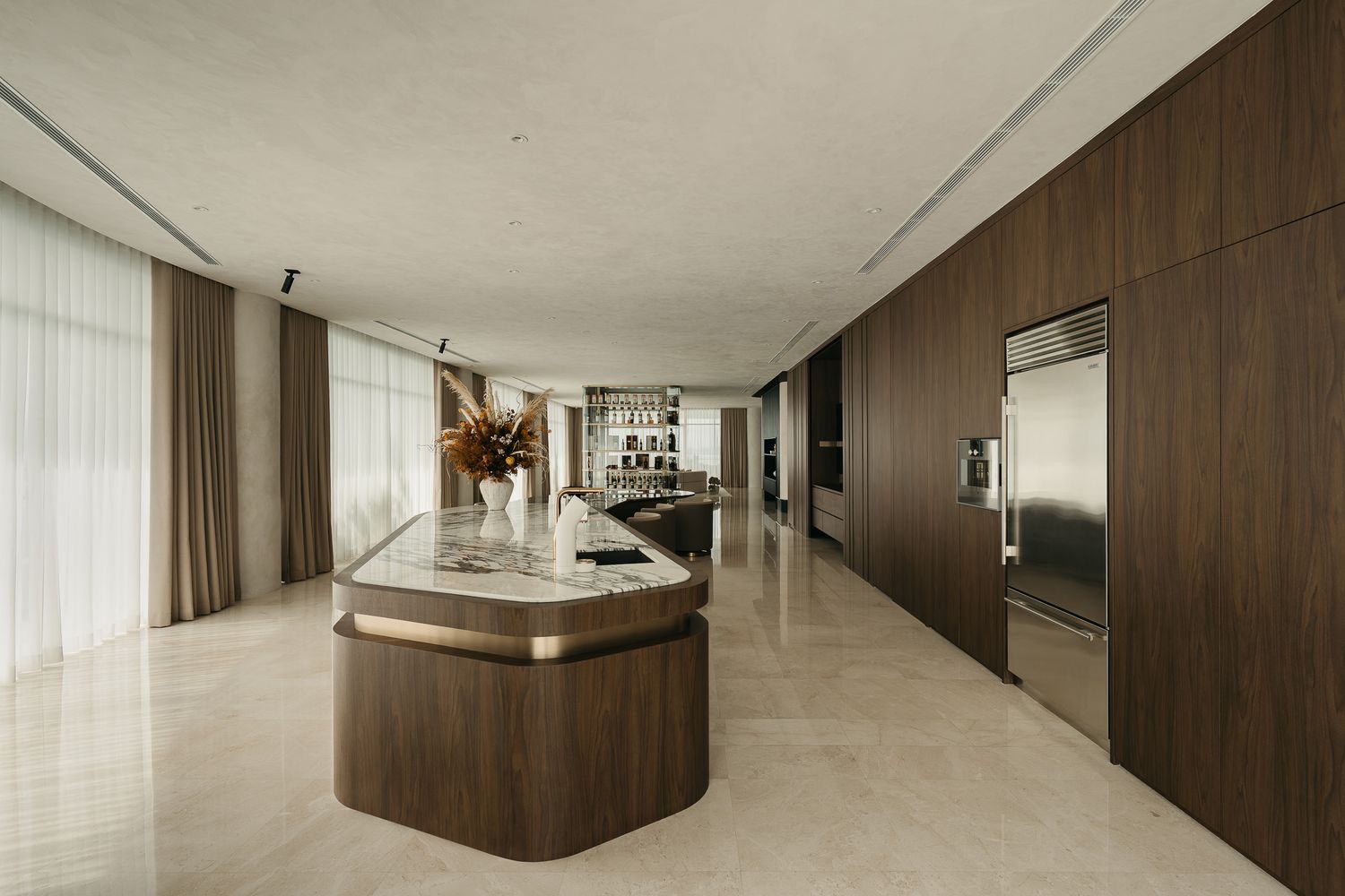 Modern minimalist interior with dark wood paneling and white walls featuring sleek lighting fixtures and clean lines.